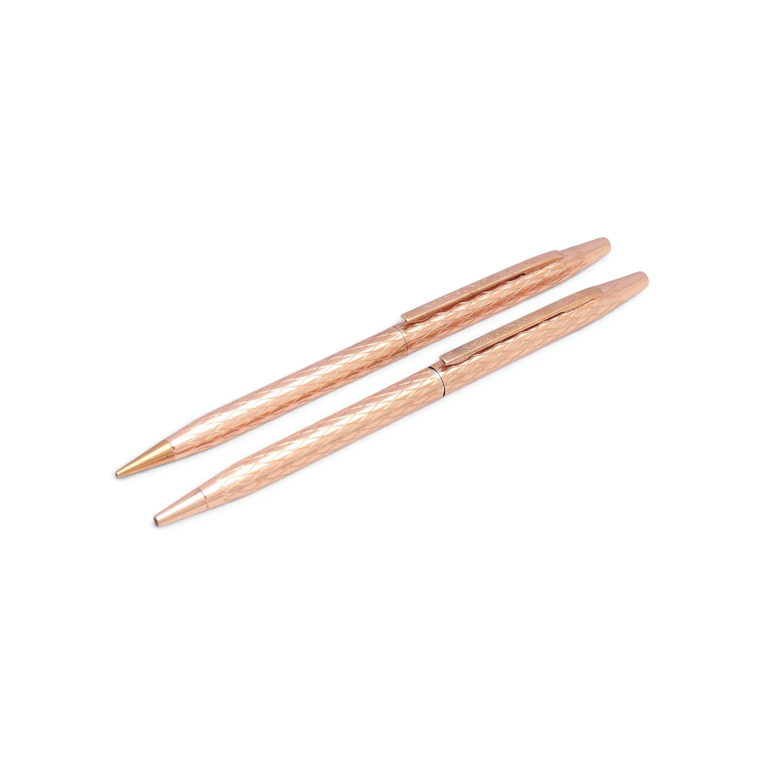 GRAND PRIX. Mechanical pencil and ballpoint pen set in copper.