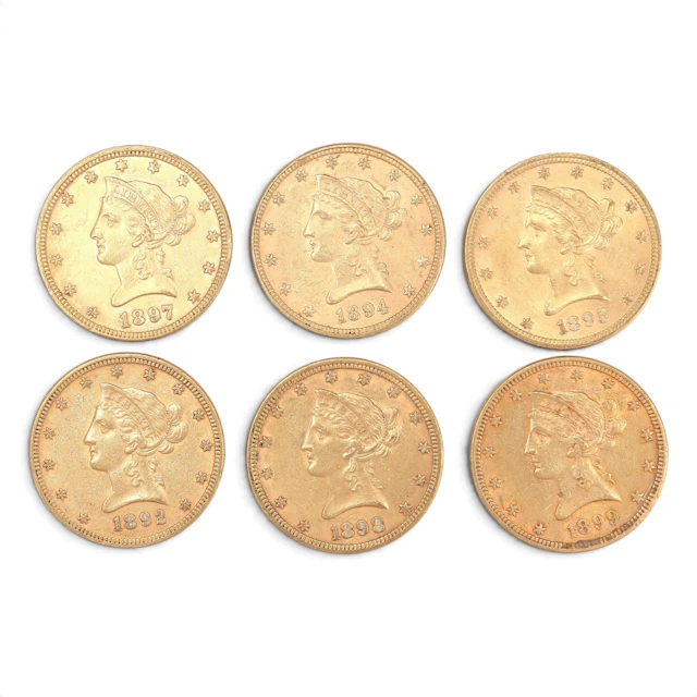 Six US gold coins, late 19th Century.