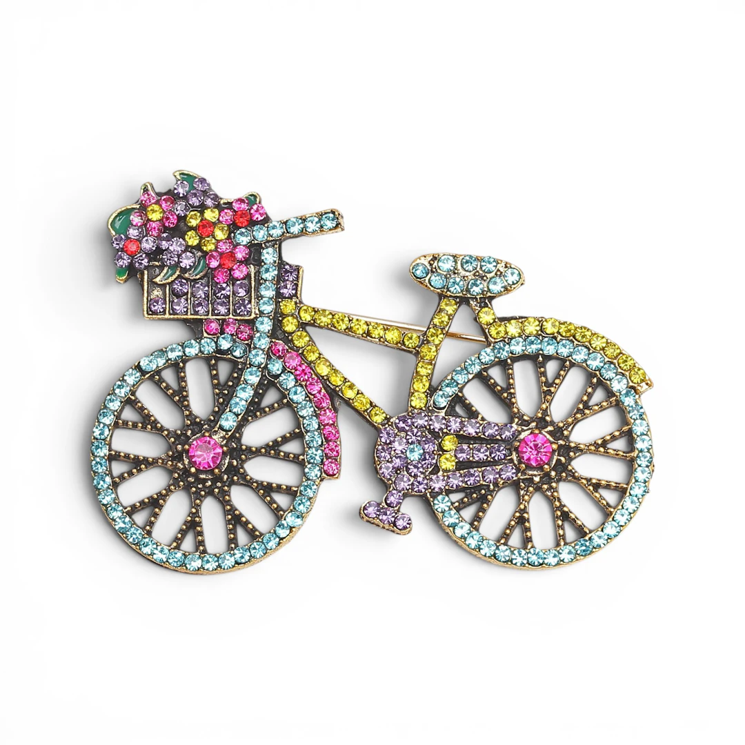 Bike-shaped brooch.