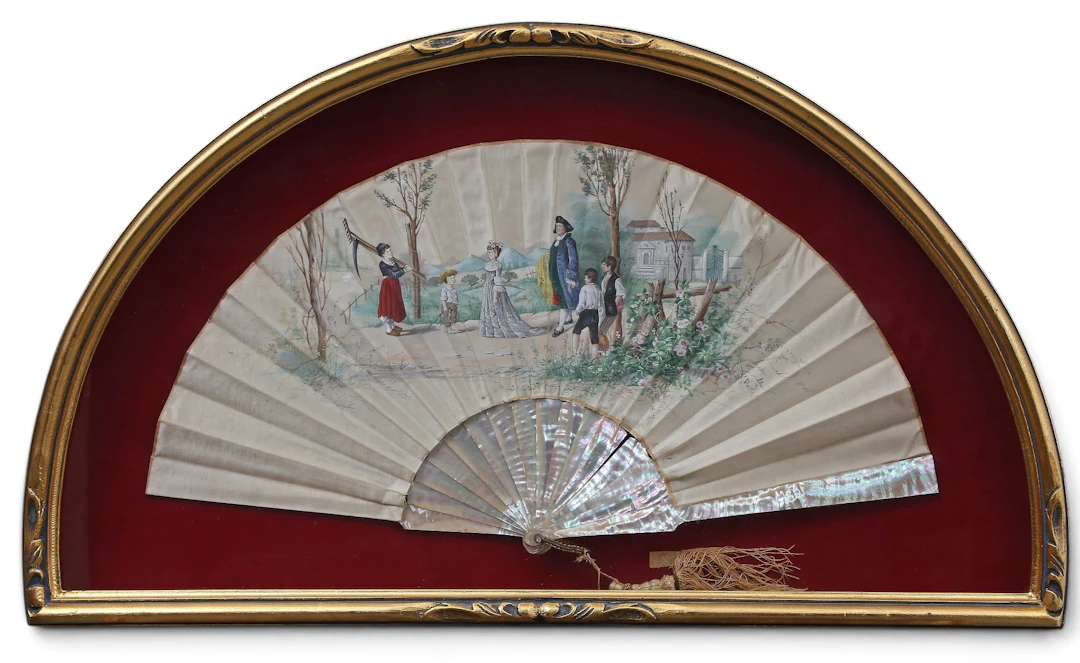 Folding fan with mother-of-pearl sticks and painted silk leaves, late
