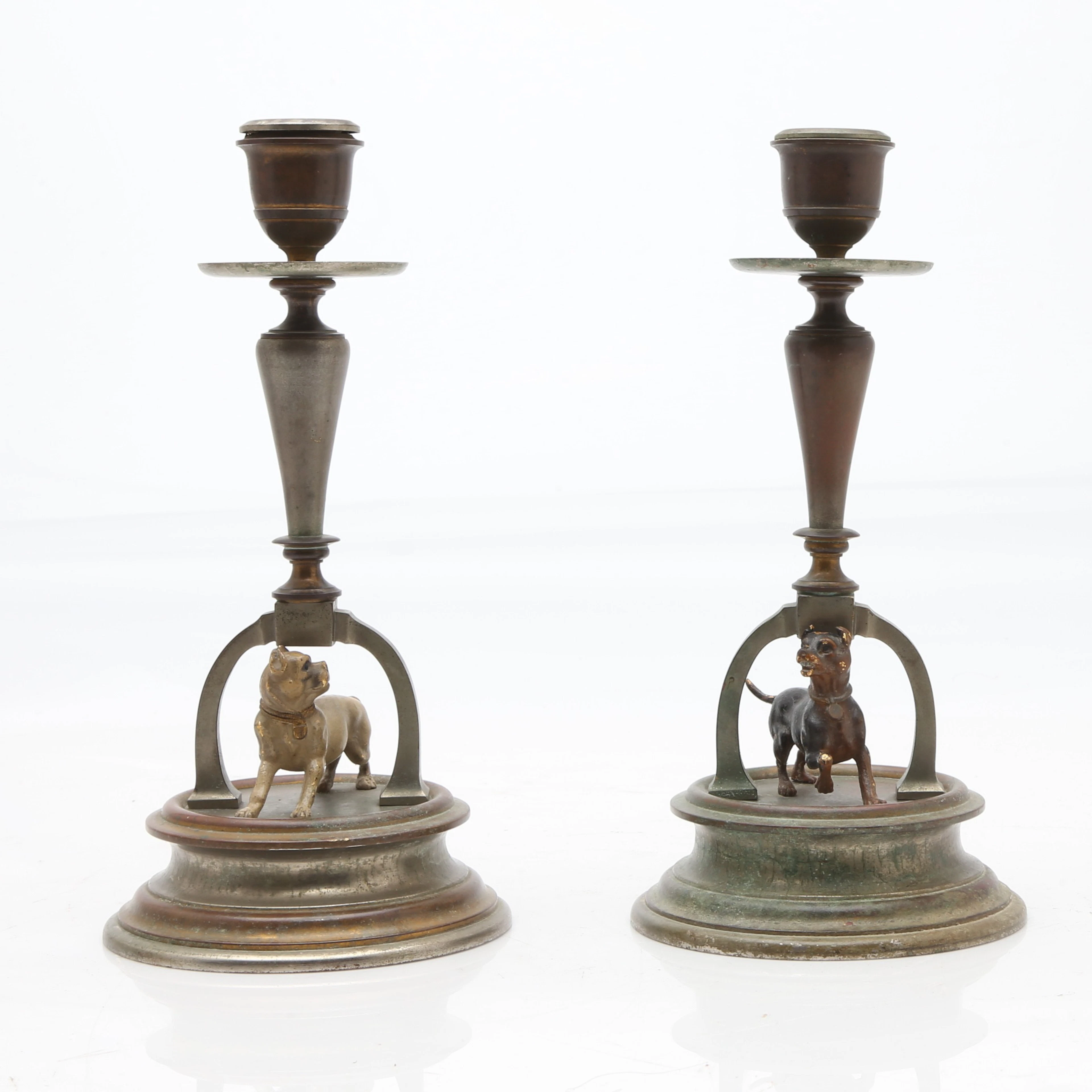 Pair of Viennese bronze candlesticks with dogs figures, first quarter