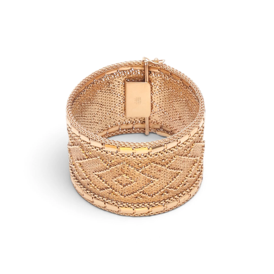 Gold mesh wide bracelet, circa 1960.