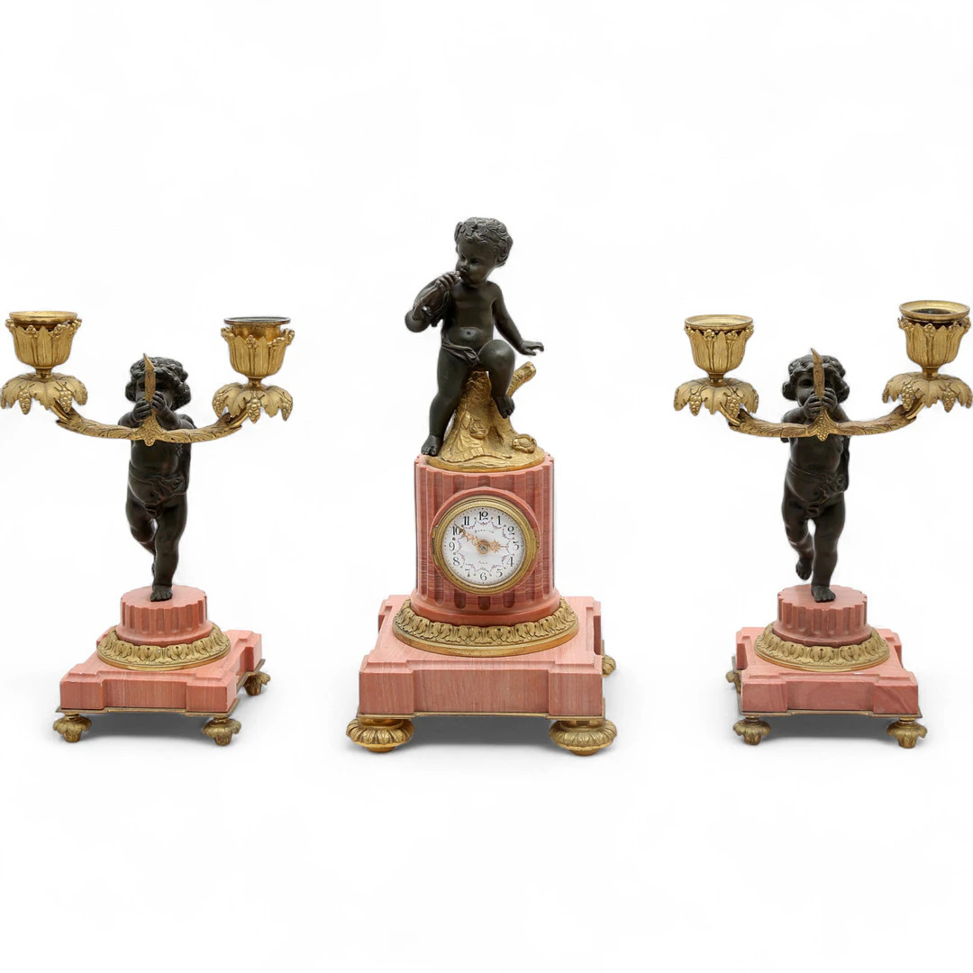 French Napoleon III Louis XVI-style mantel clock set in gilt and patinated