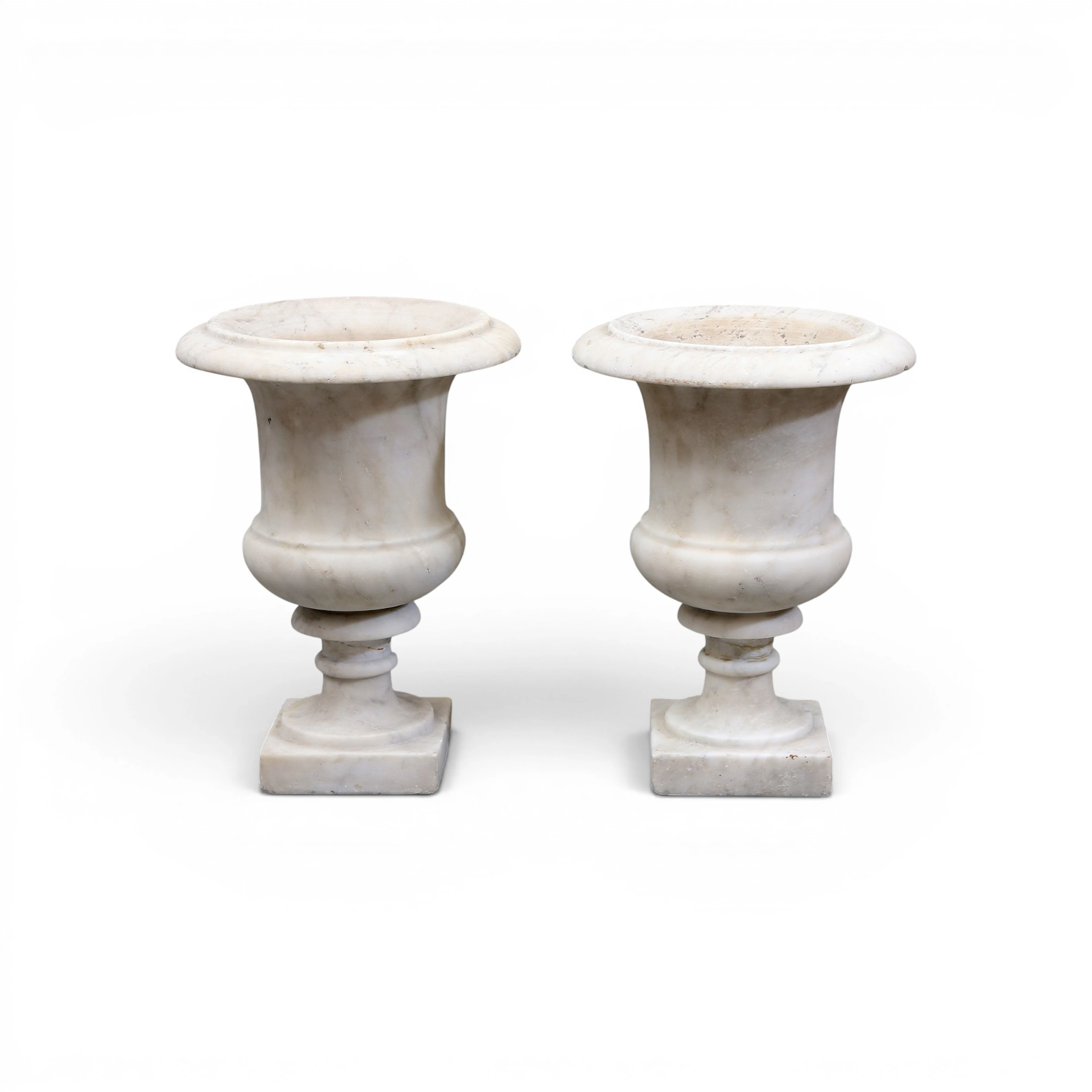PAIR of Medici-style marble urns, from the early 20th century.