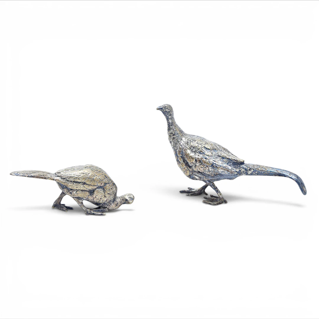 Two silvery metal small pheasants, 20th Century.