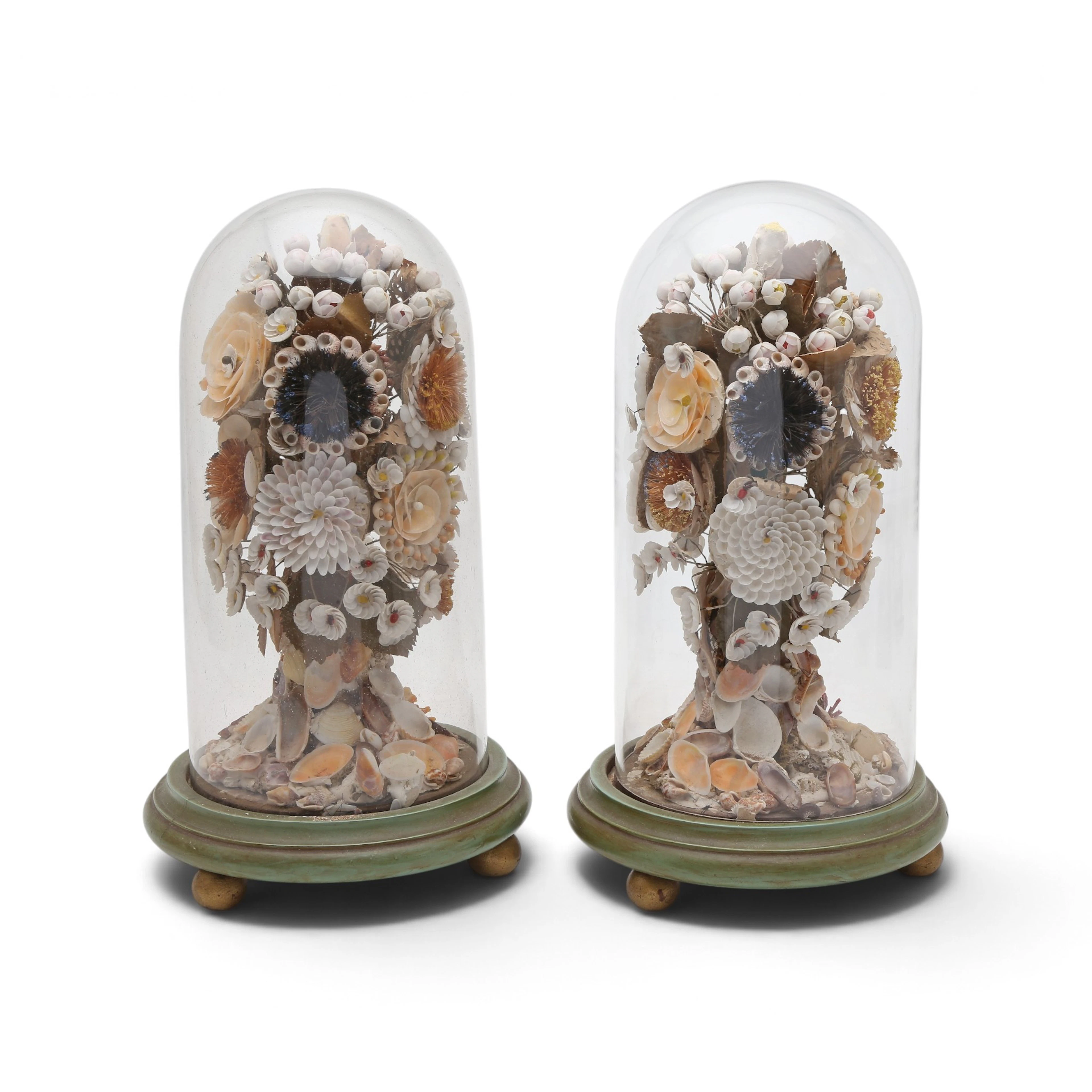 Pair of Victorian fabric and shell floral arrangements with glass