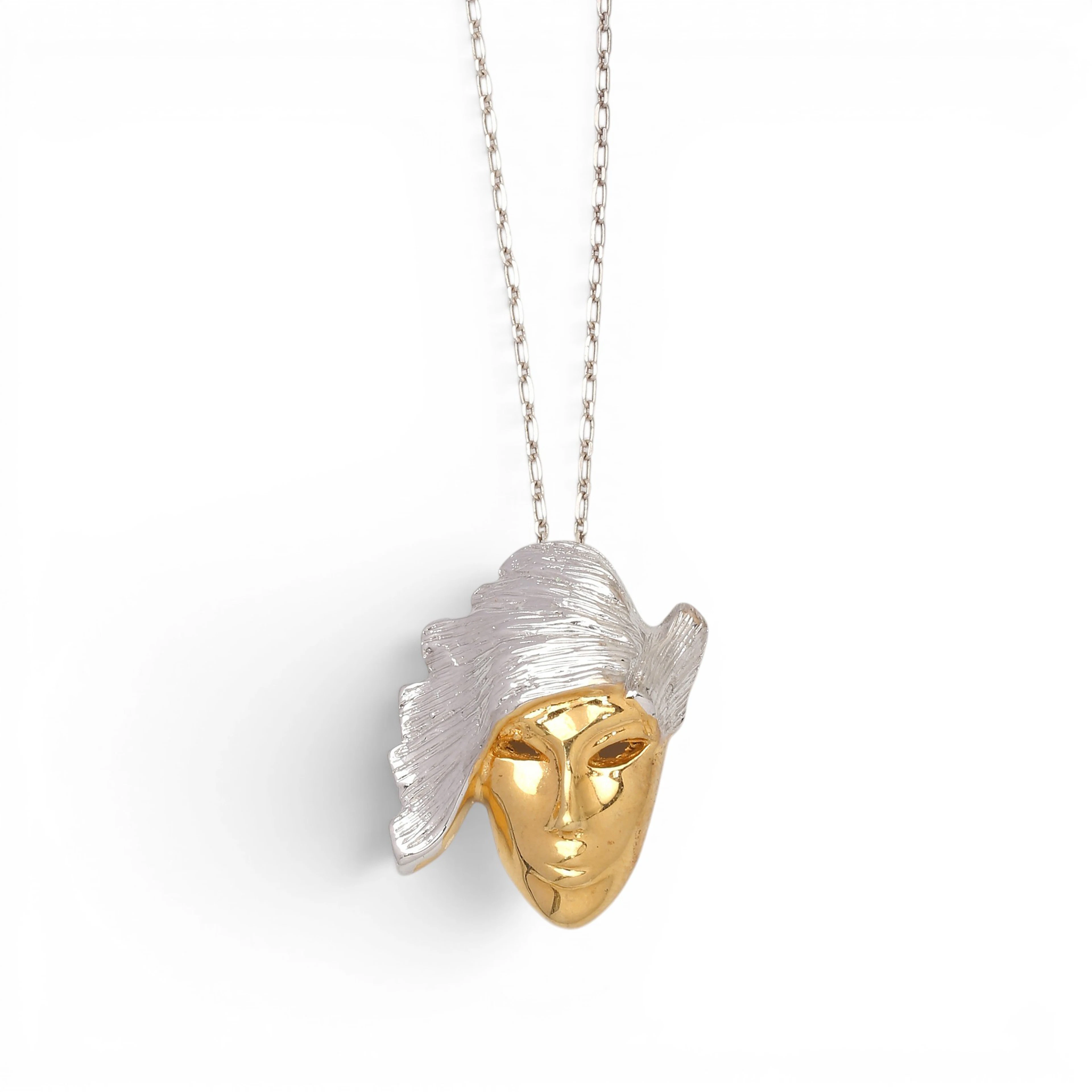 Mask-shaped pendant.