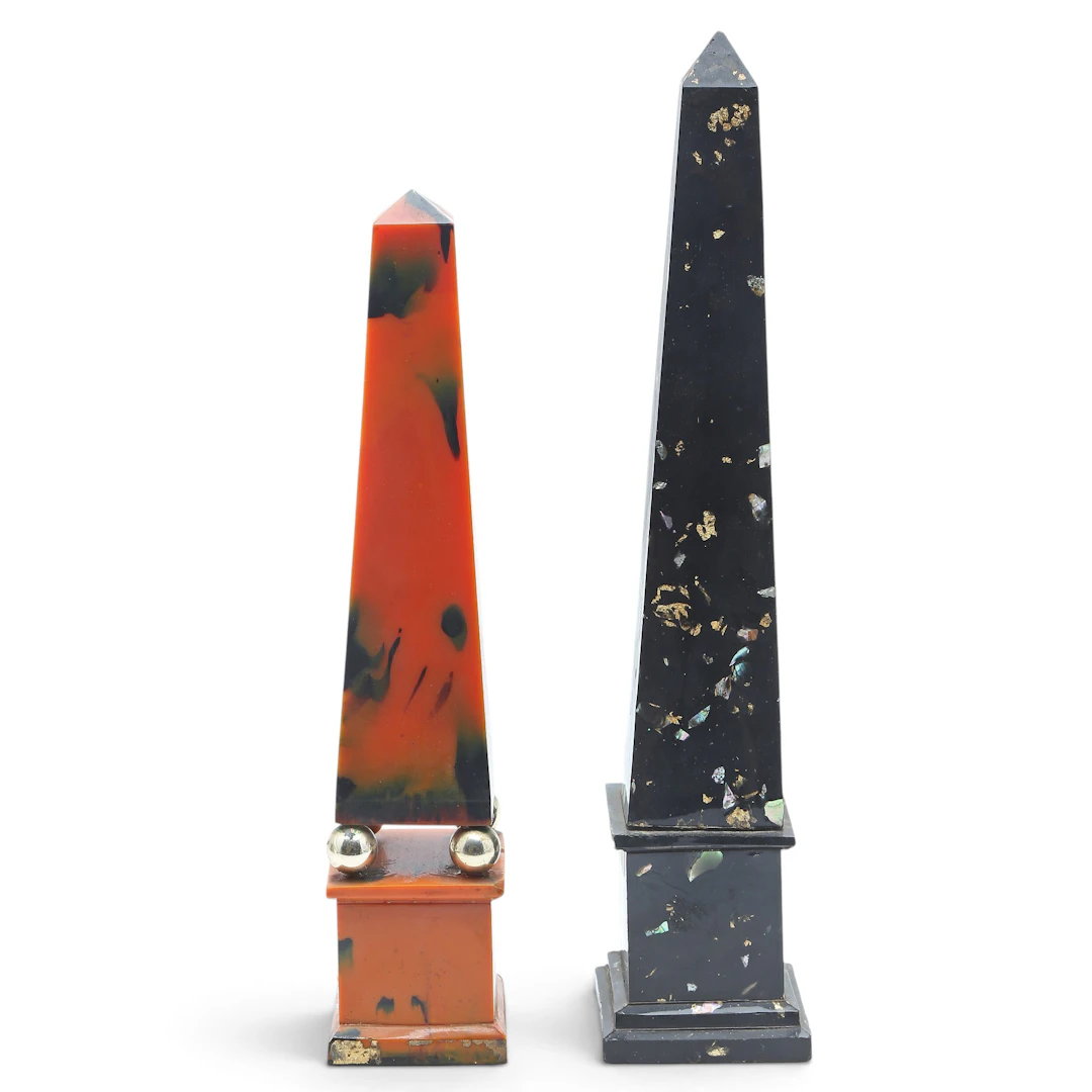 Two obelisks in faux marble resin, 20th Century.