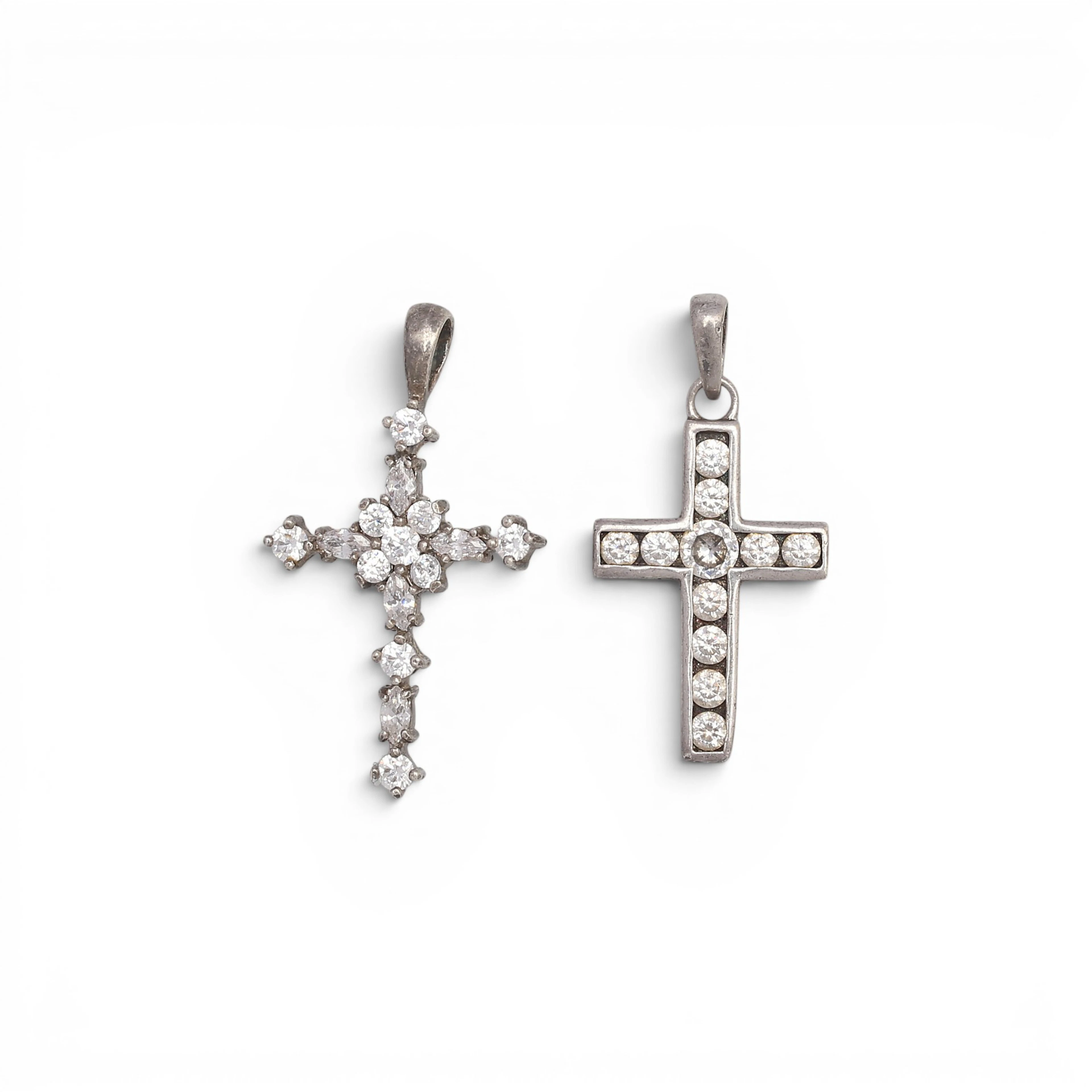 Two zircons pendant crosses.