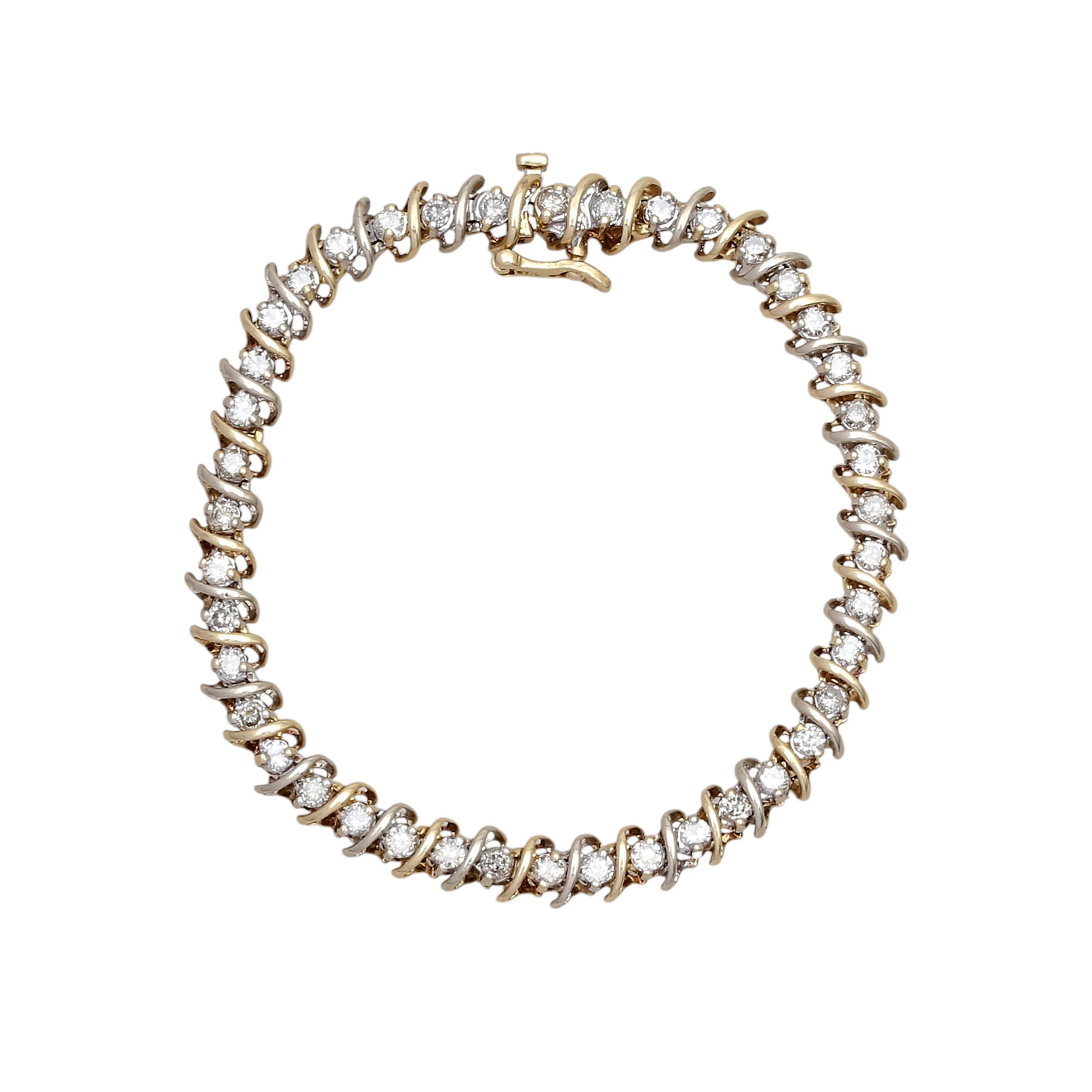 Pulsera rivière de diamantes en oro bicolor.