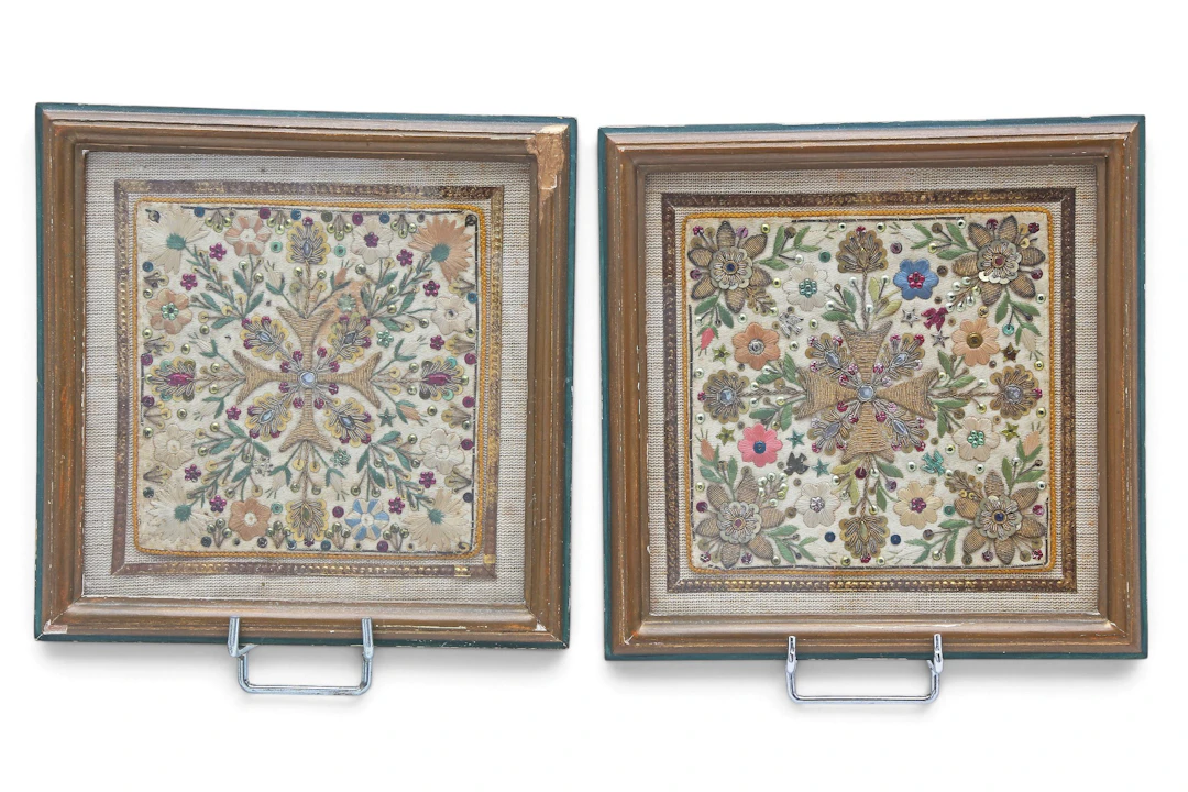 Pair of floral panels in embroidered silk, 19th Century.