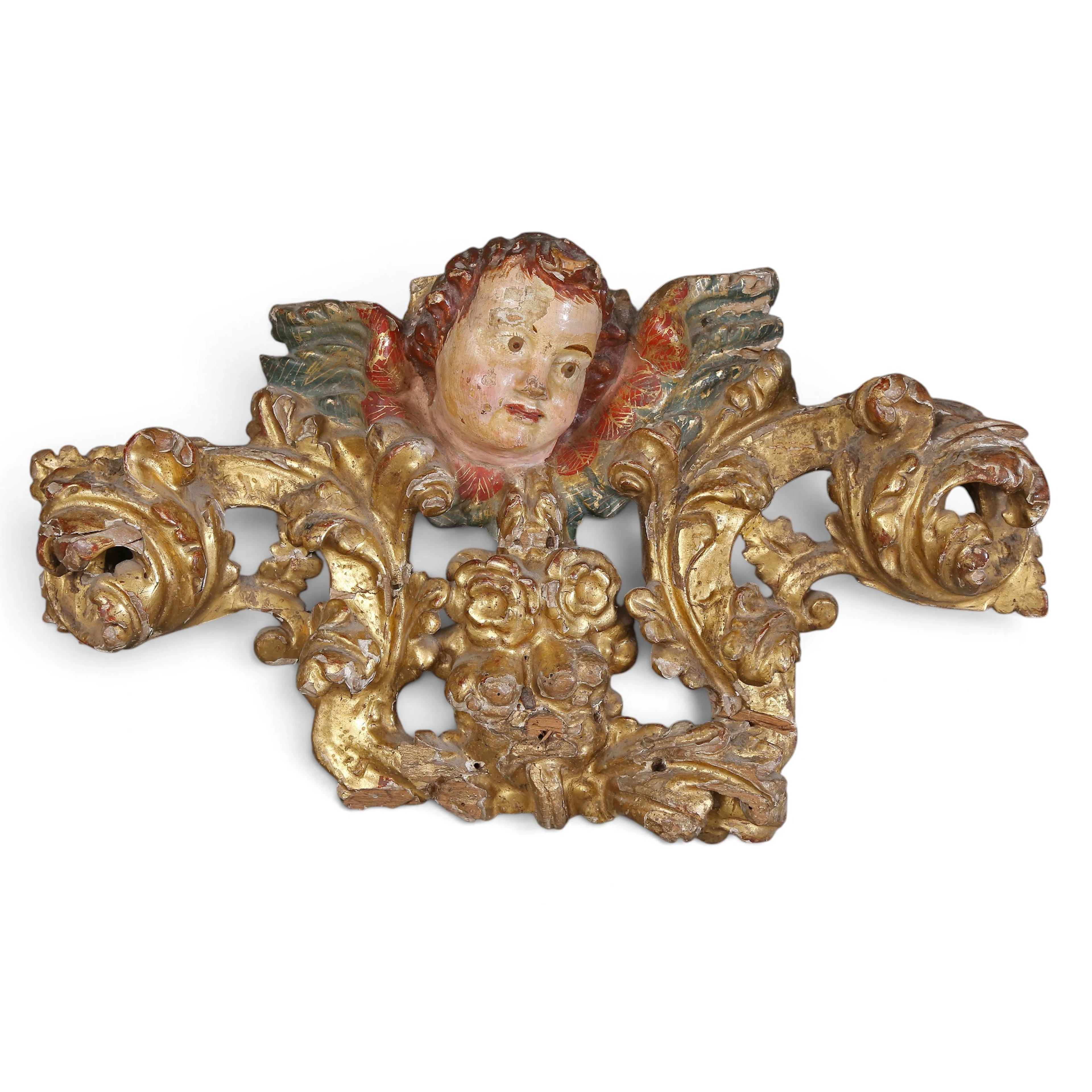 SPANISH SCHOOL, 18TH CENTURY. Cherub head with scrolls and foliage.