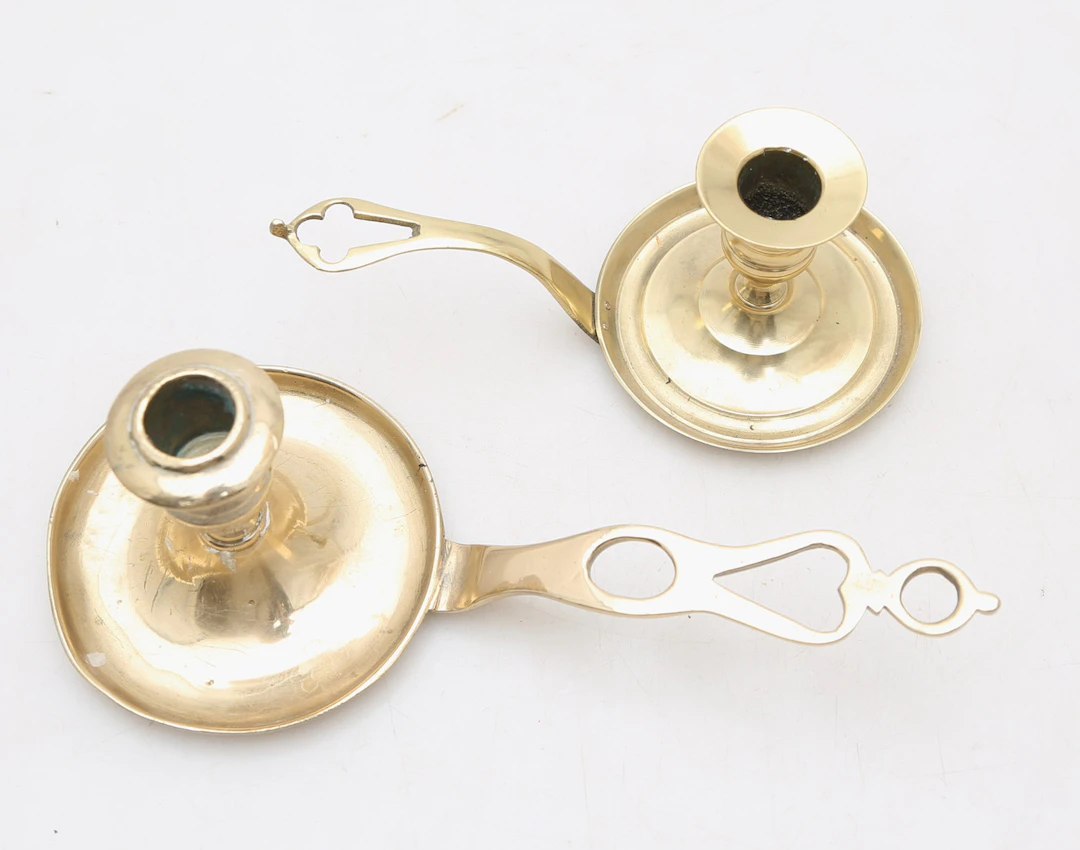 Two brass candle holders, early decades of the 20th Century.