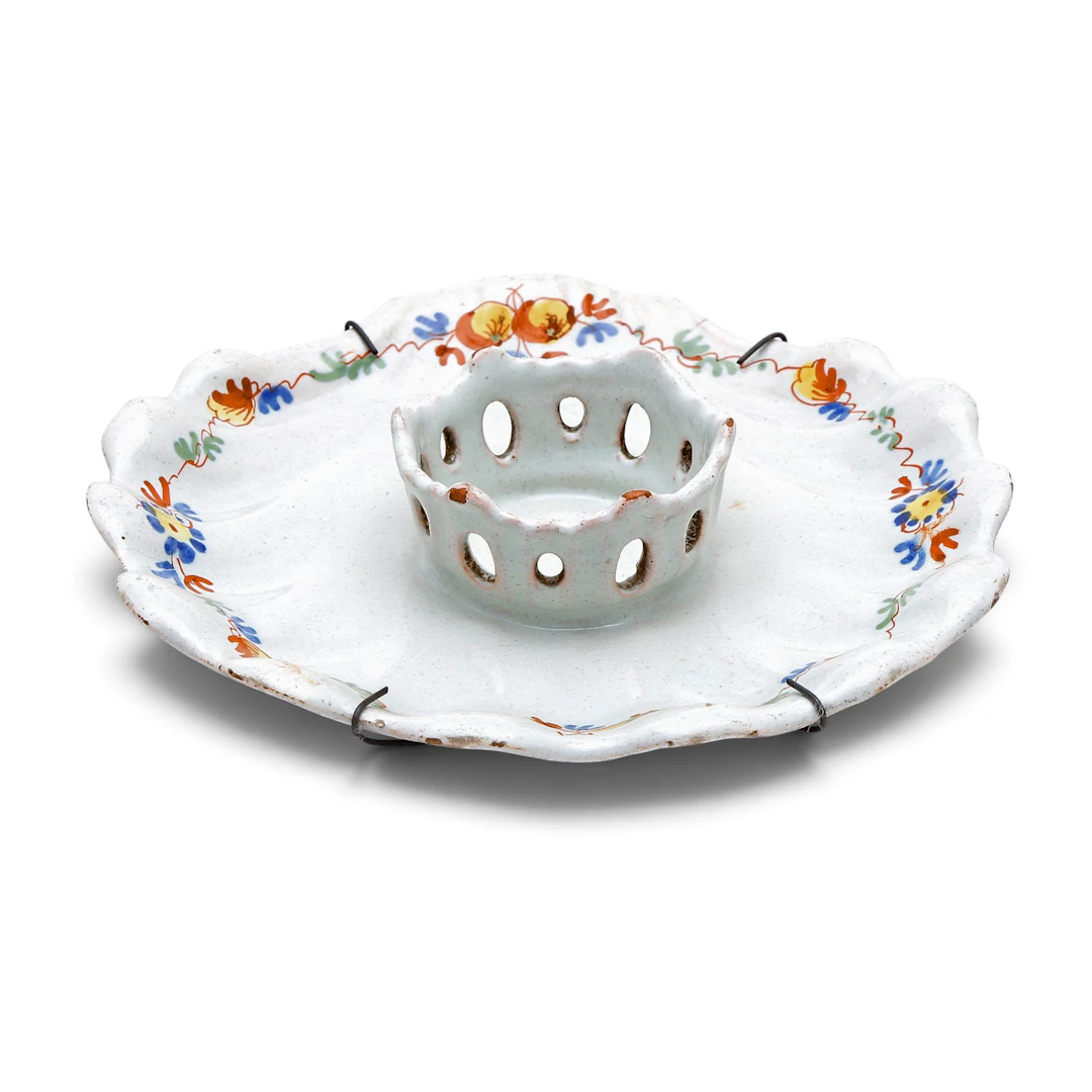 Alcora earthenware mancerina from the “El Ramito” series, 18th century.