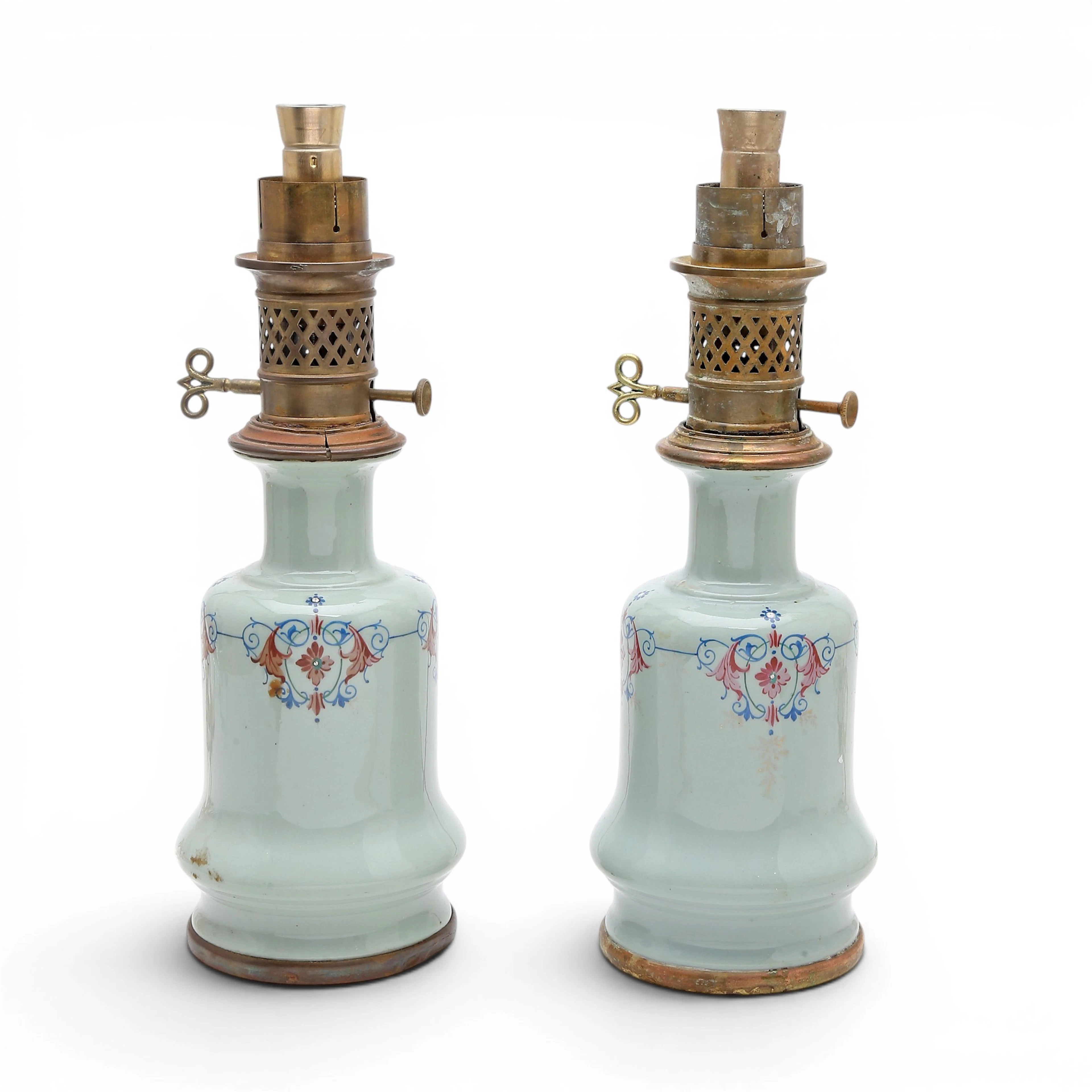Pair of French table lamps in earthenware and brass, late 19th Century.