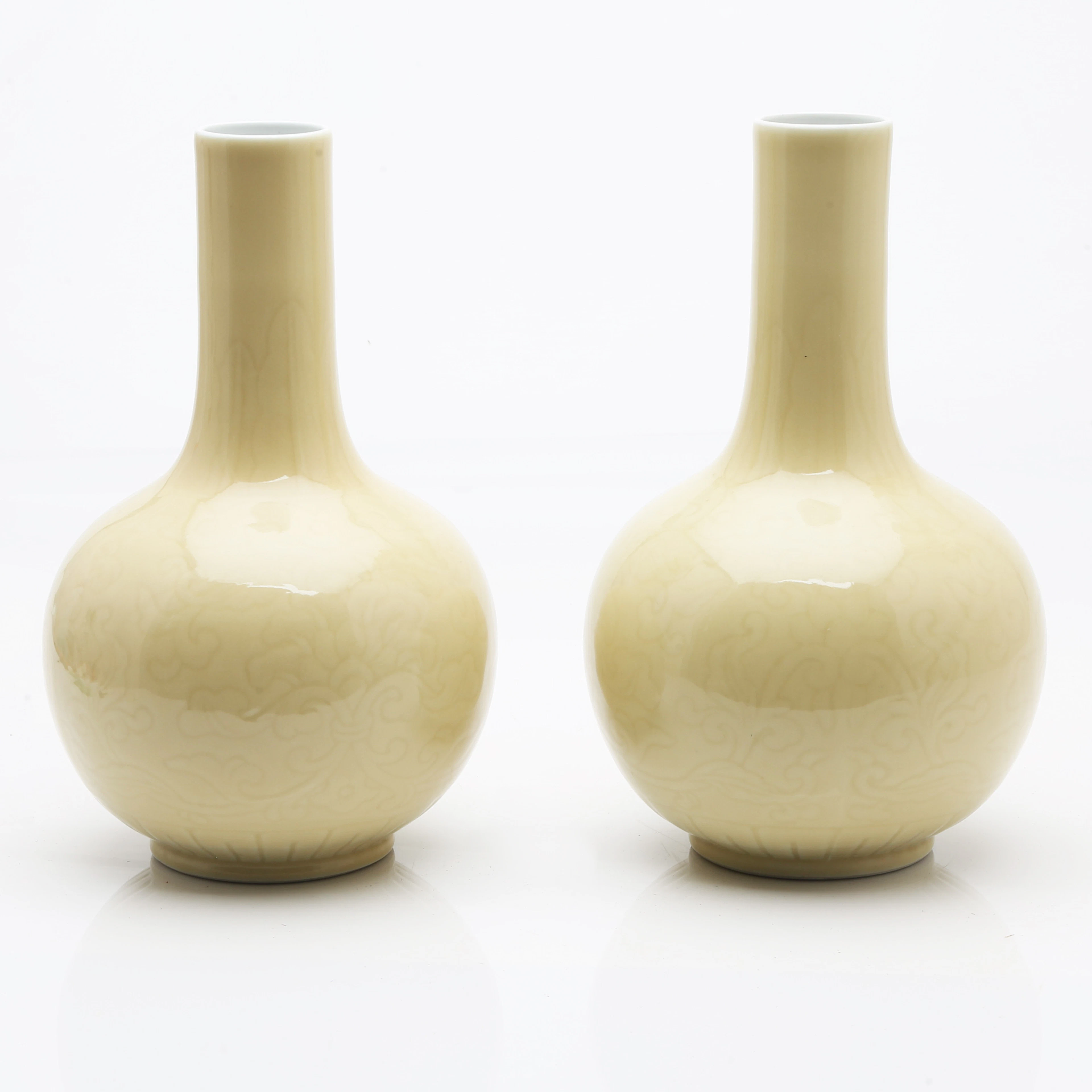 Pair of Chinese Qianlong-style pale yellow porcelain vases, 20th Century.
