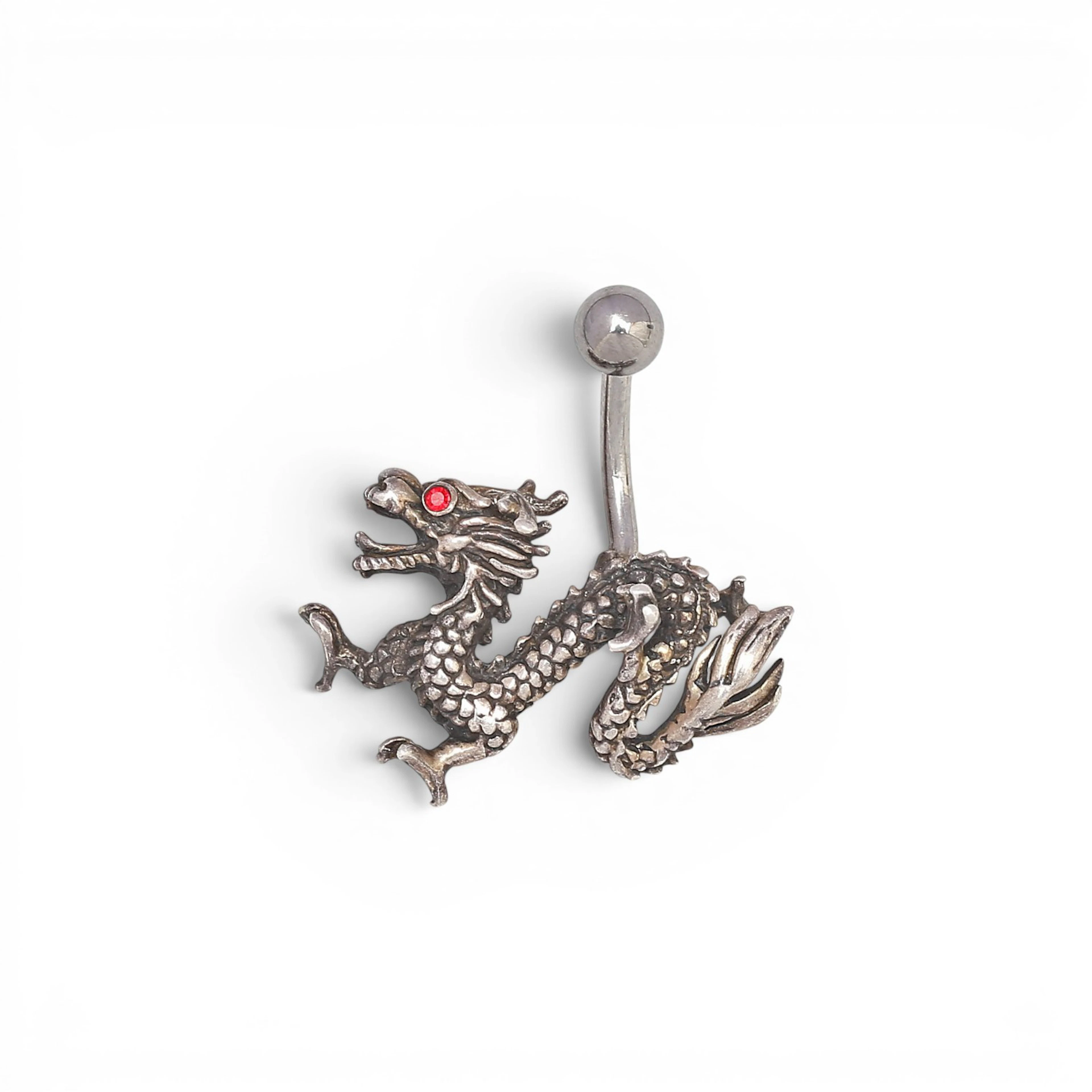 Silver piercing in the shape of a Chinese dragon.