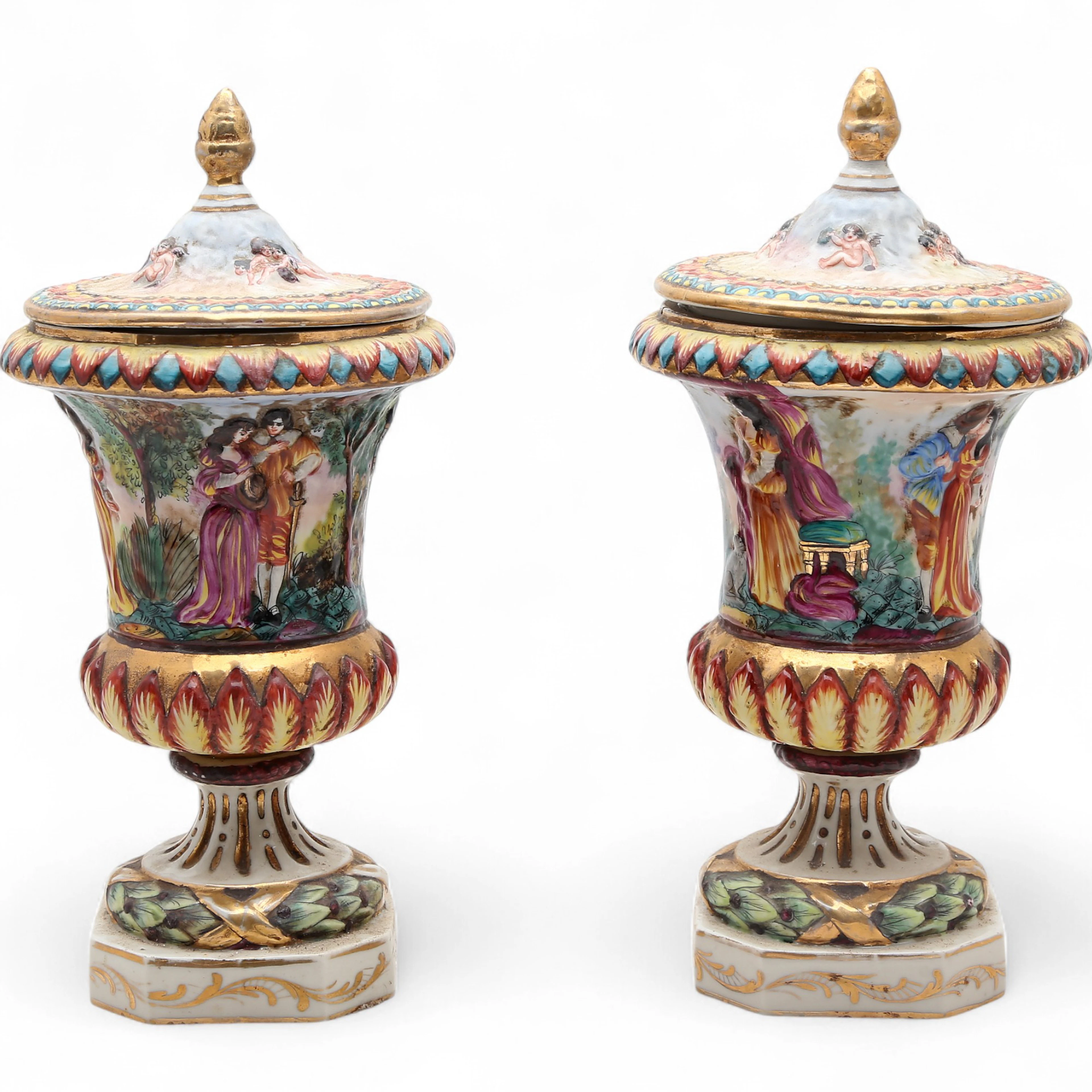 Pair of Capodimonte-style lidded urns in porcelain, first third of