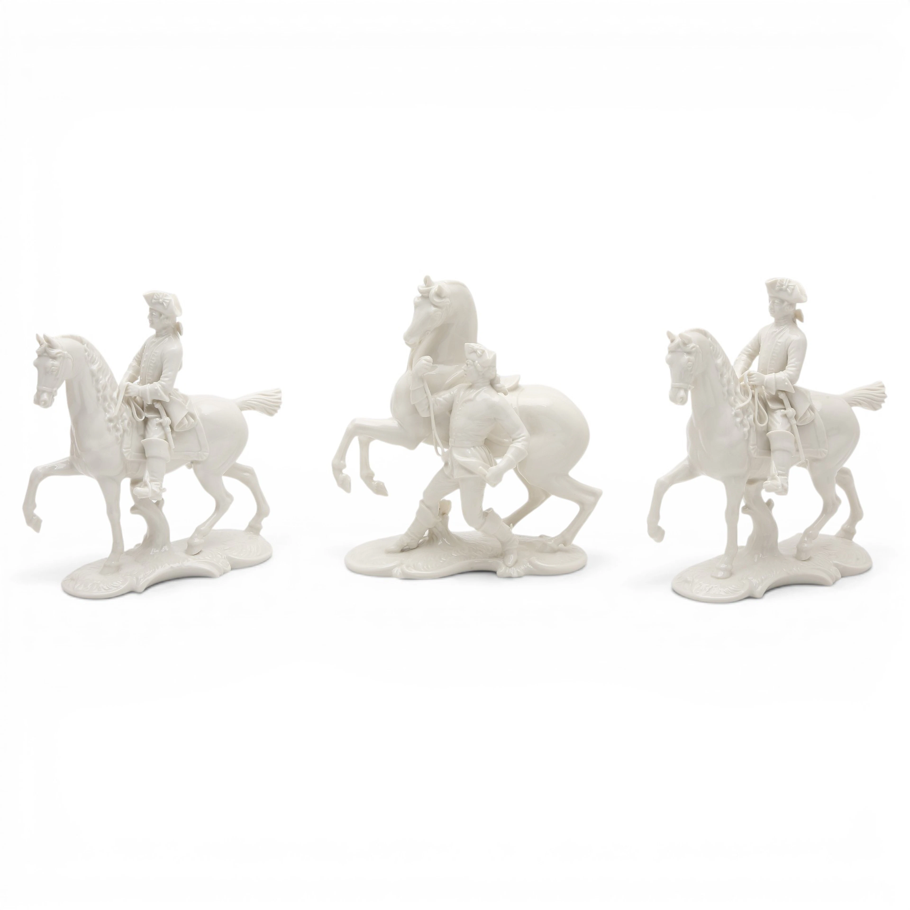 "Horsemen", three glazed porcelain figures from Nymphenburg, 20th Century.