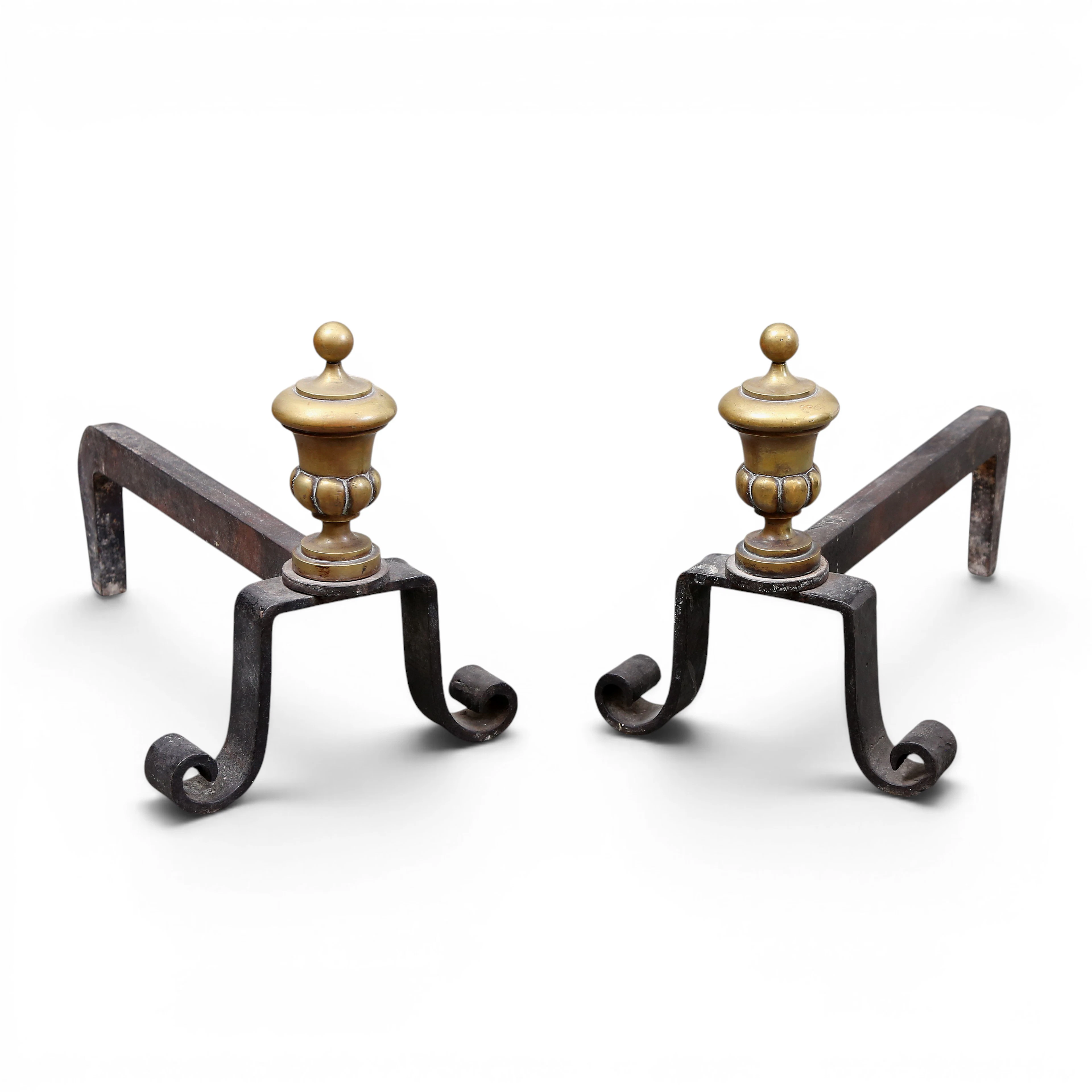 Pair of French andirons in brass and iron, 19th Century.