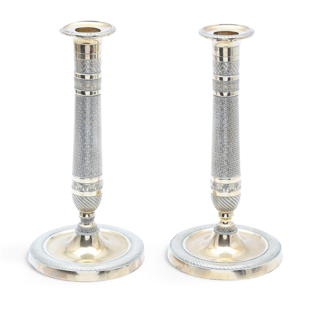 Pair of French Charles X gilt bronze candlesticks, 19th Century.