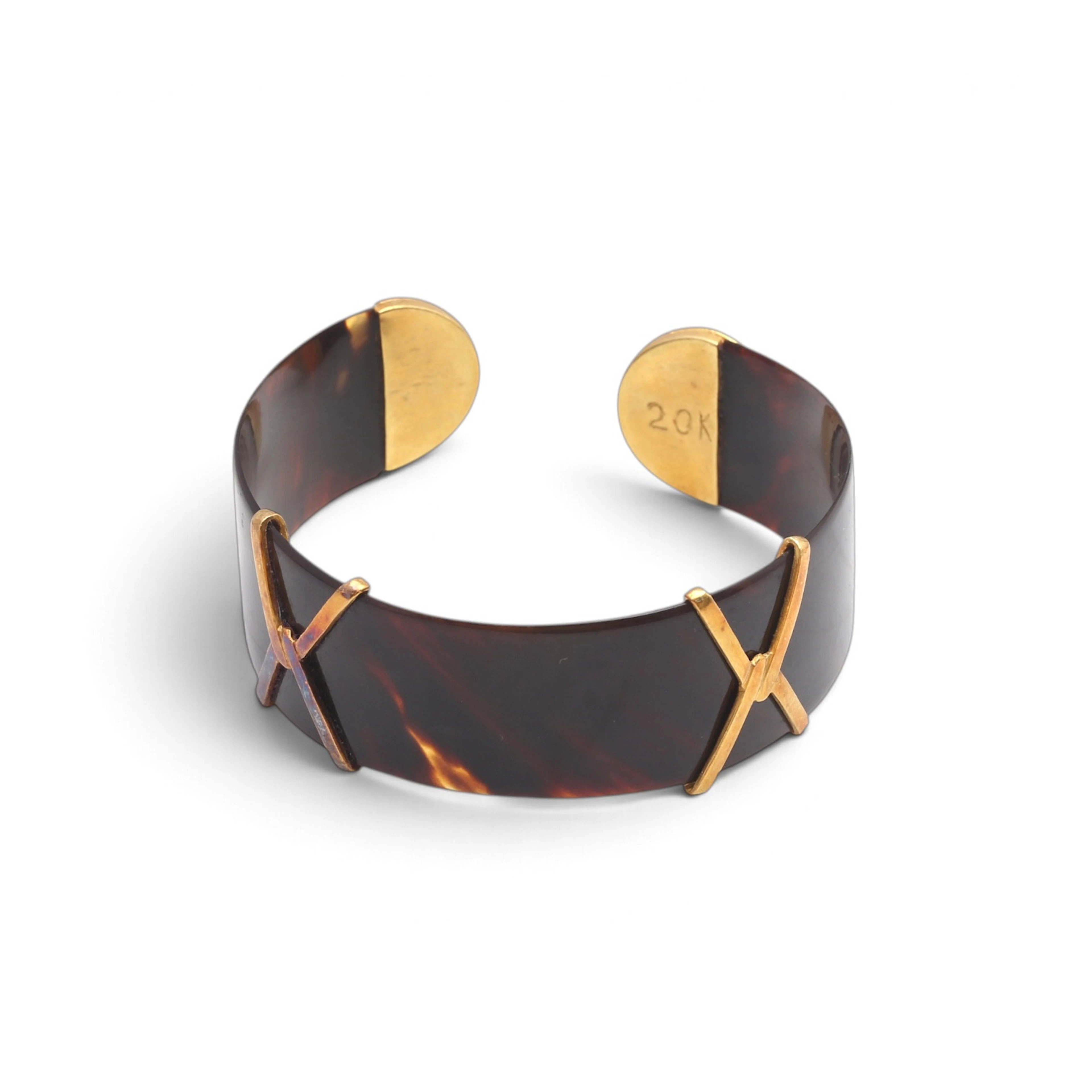 Open bangle bracelet in gild.