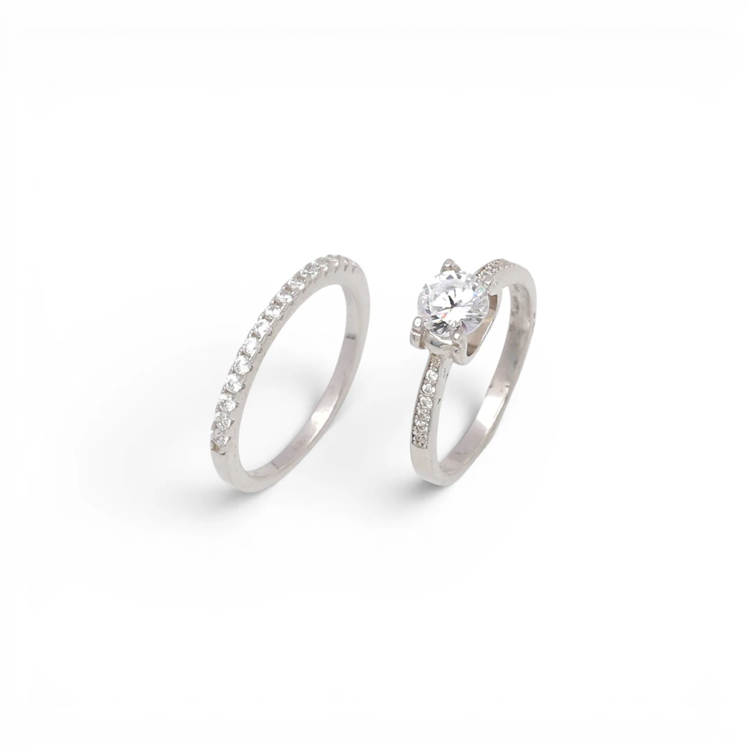 Solitaire ring and half-band ring with zircons.