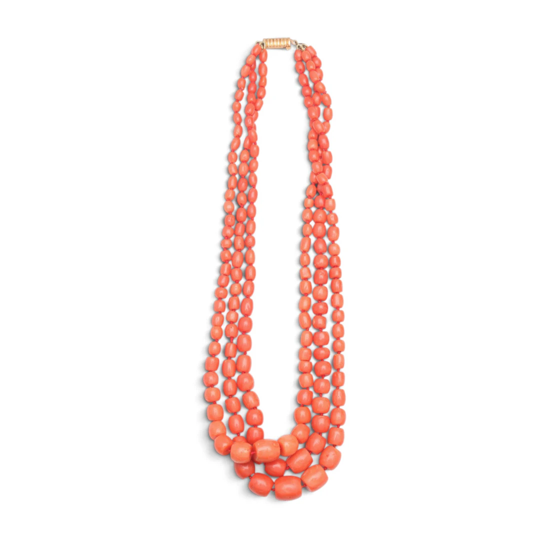 Three-strand coral choker.