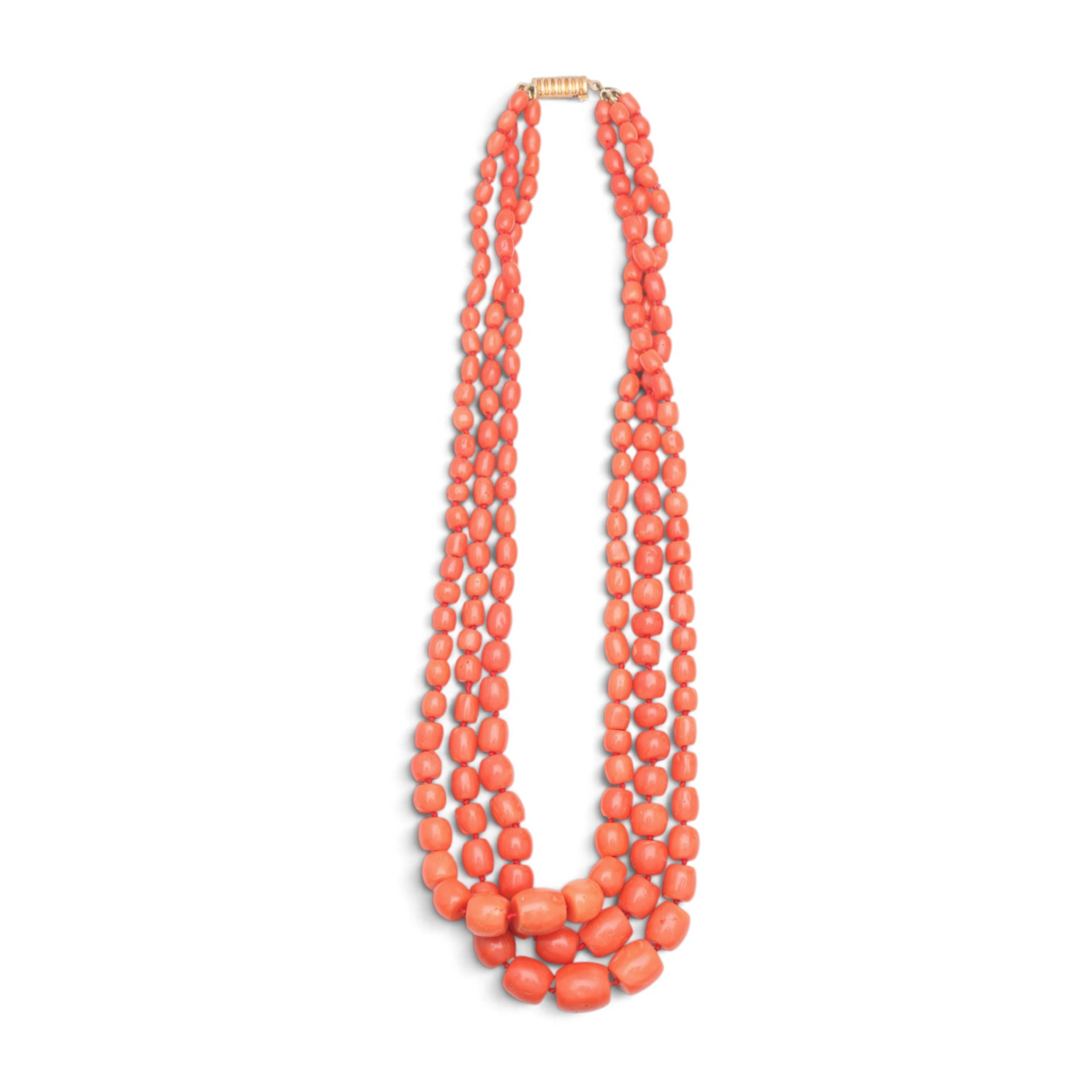 Three-strand coral choker.