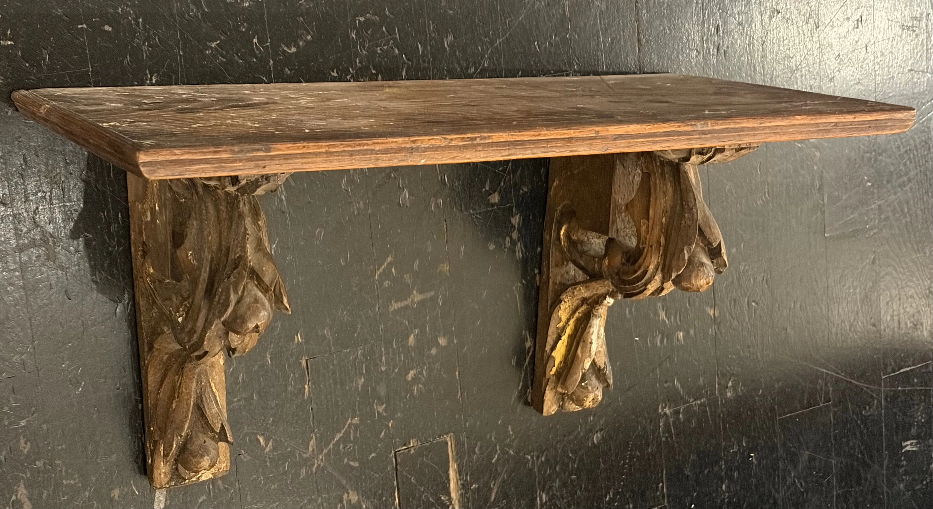 Pedestal consisting of two carved wood corbels with traces of polychrome