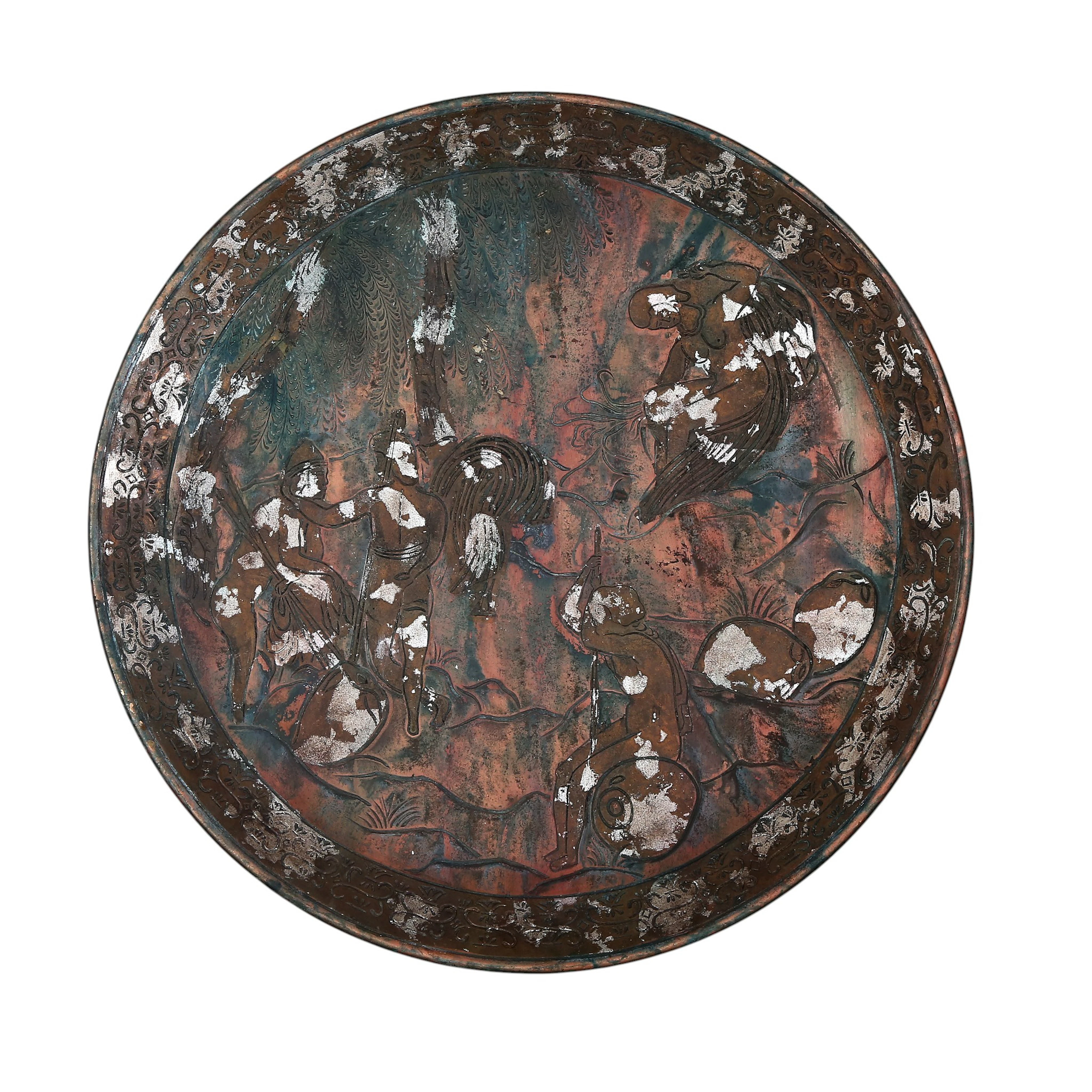 Large dish, probably Filipino, in engraved stucco with coppery patina