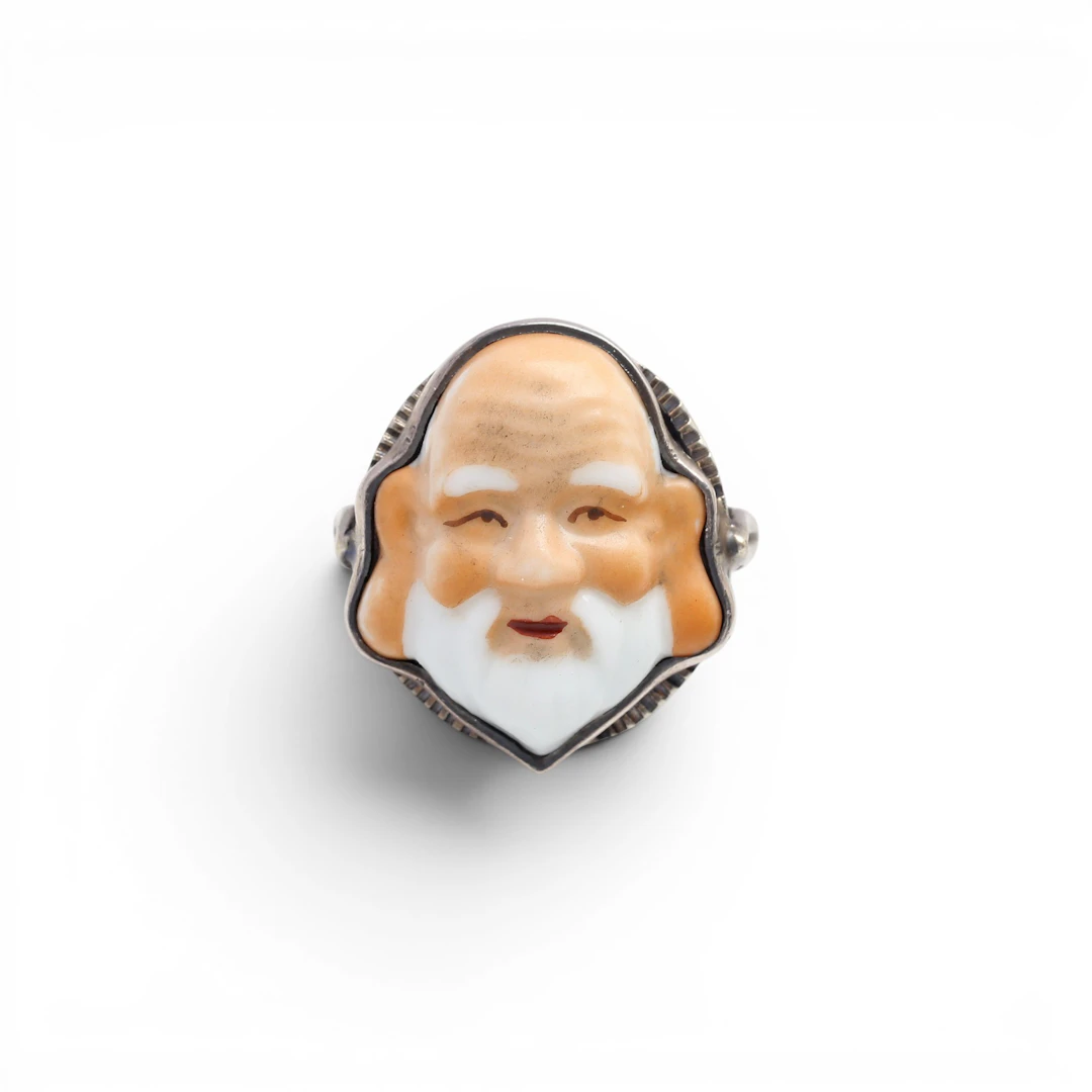 Toshikane ring with the god Fukurokuju, mid 20th Century.