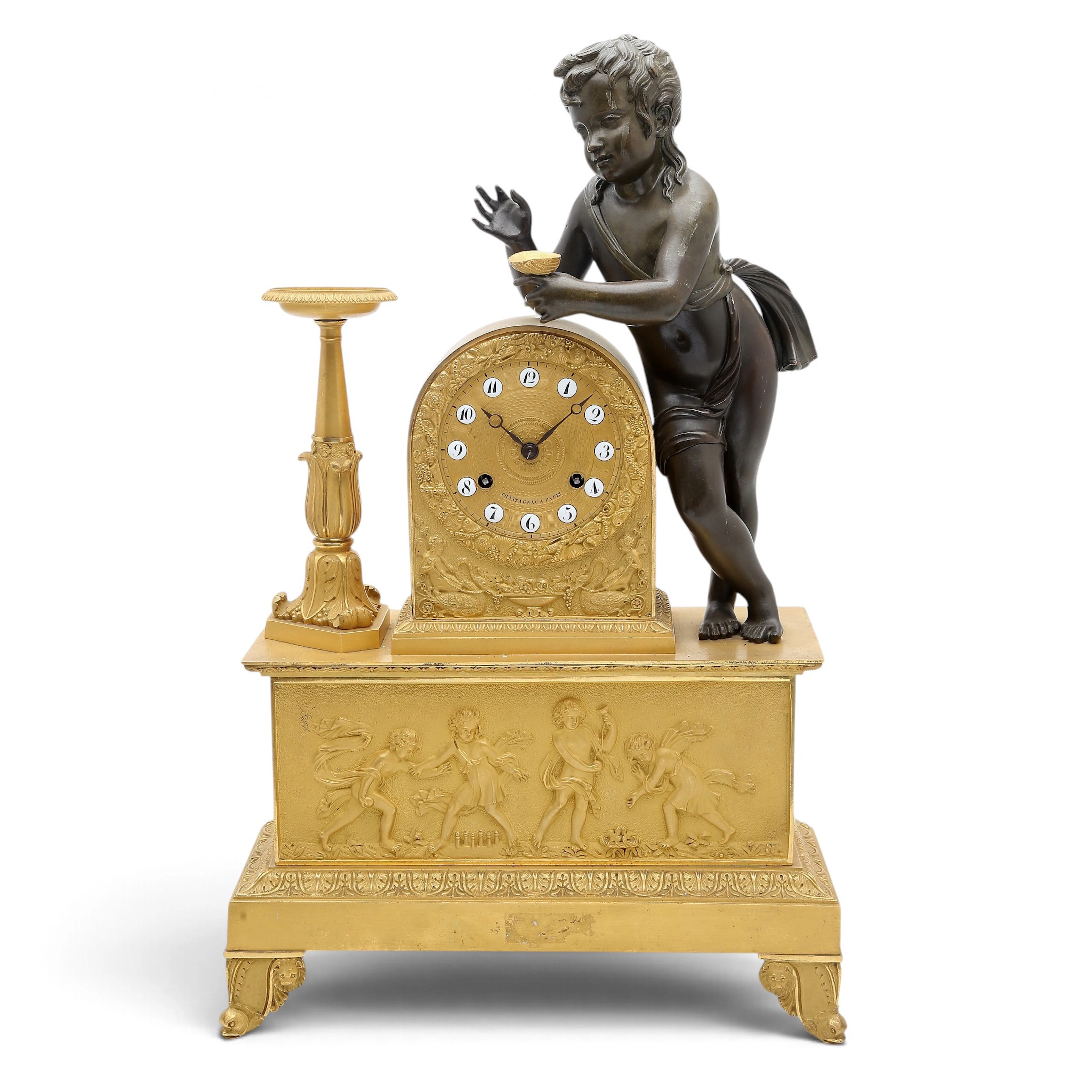 French Charles X mantel clock centered by a classical child in gilt