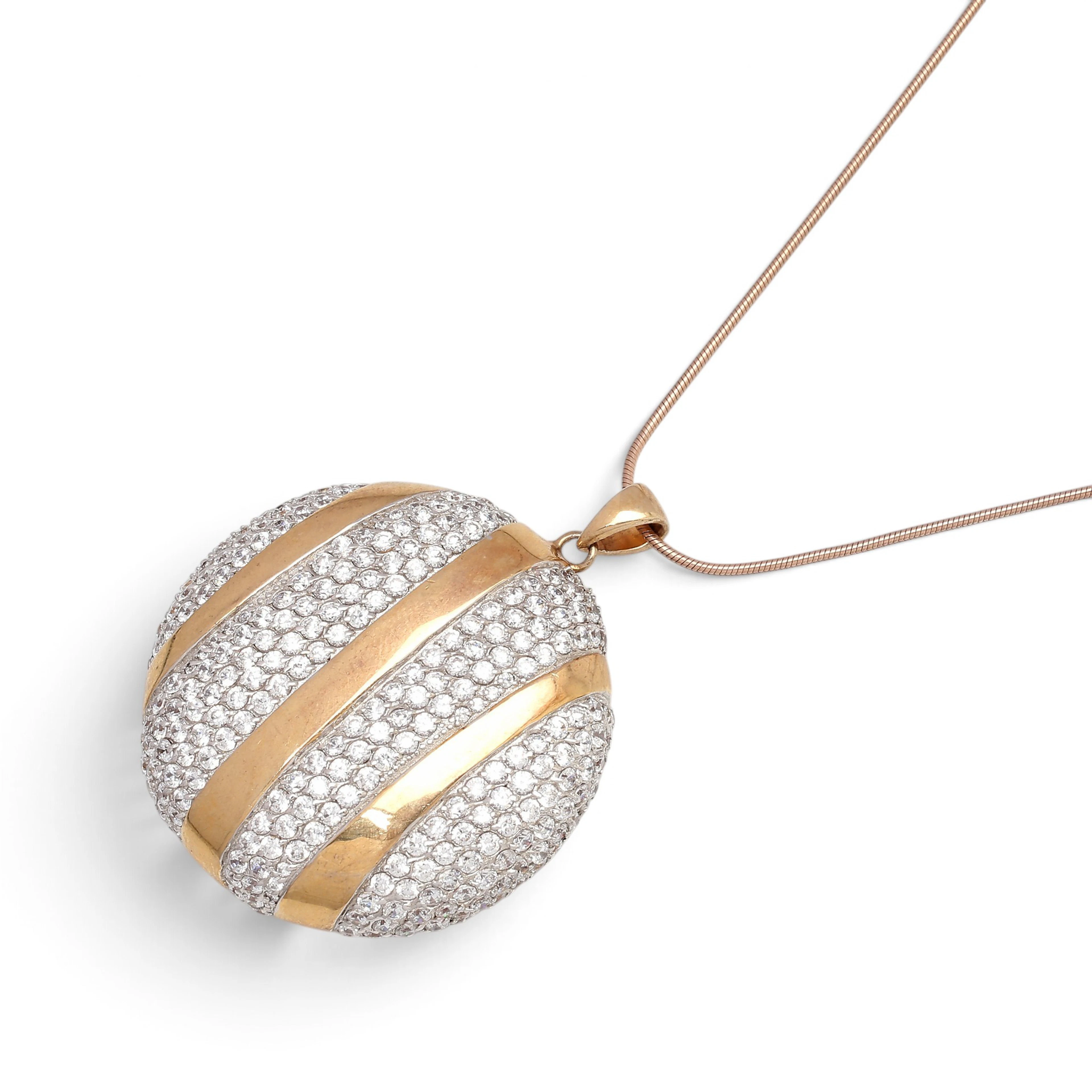 Over-gilded silver and zircons pendant.