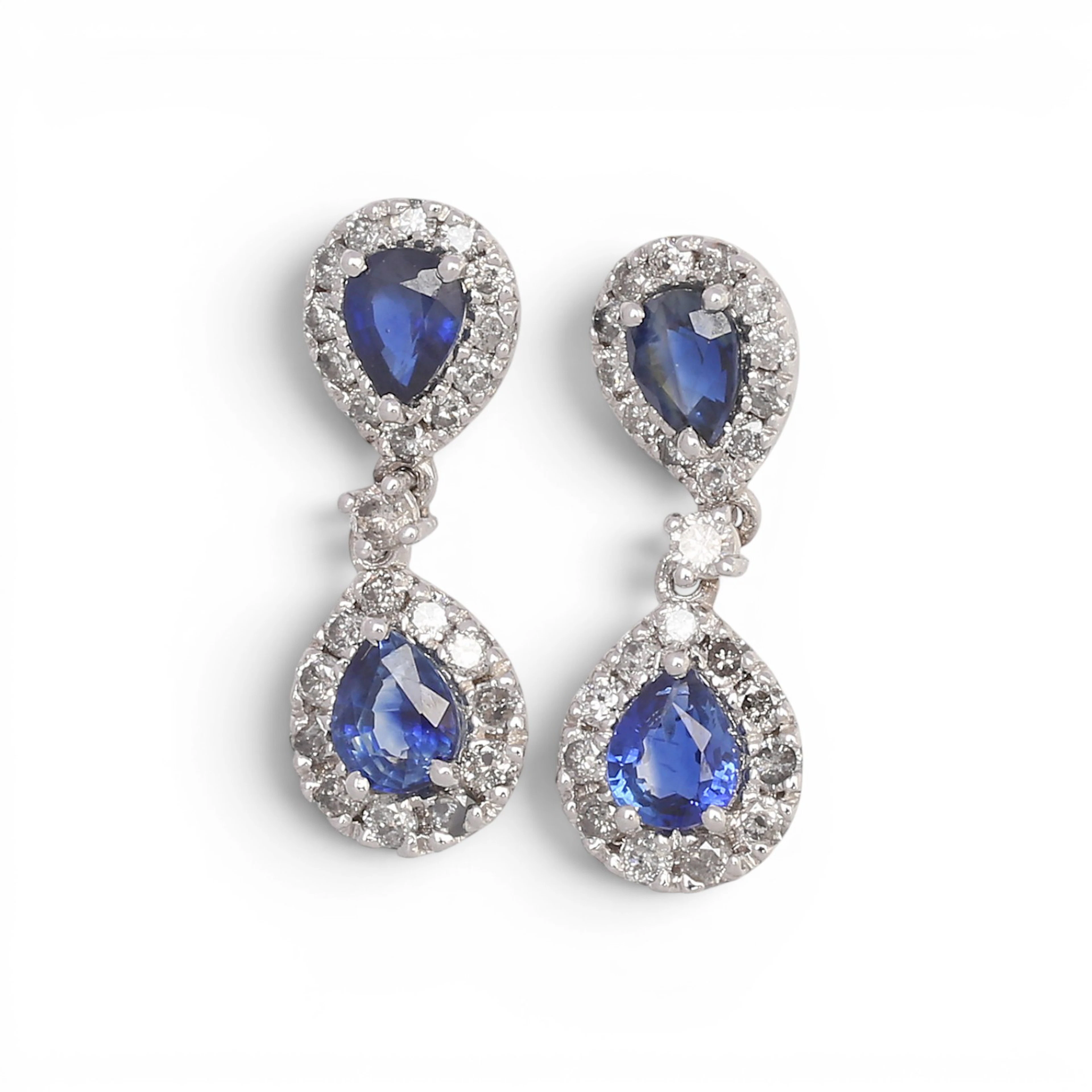 Sapphires and diamonds long earrings.