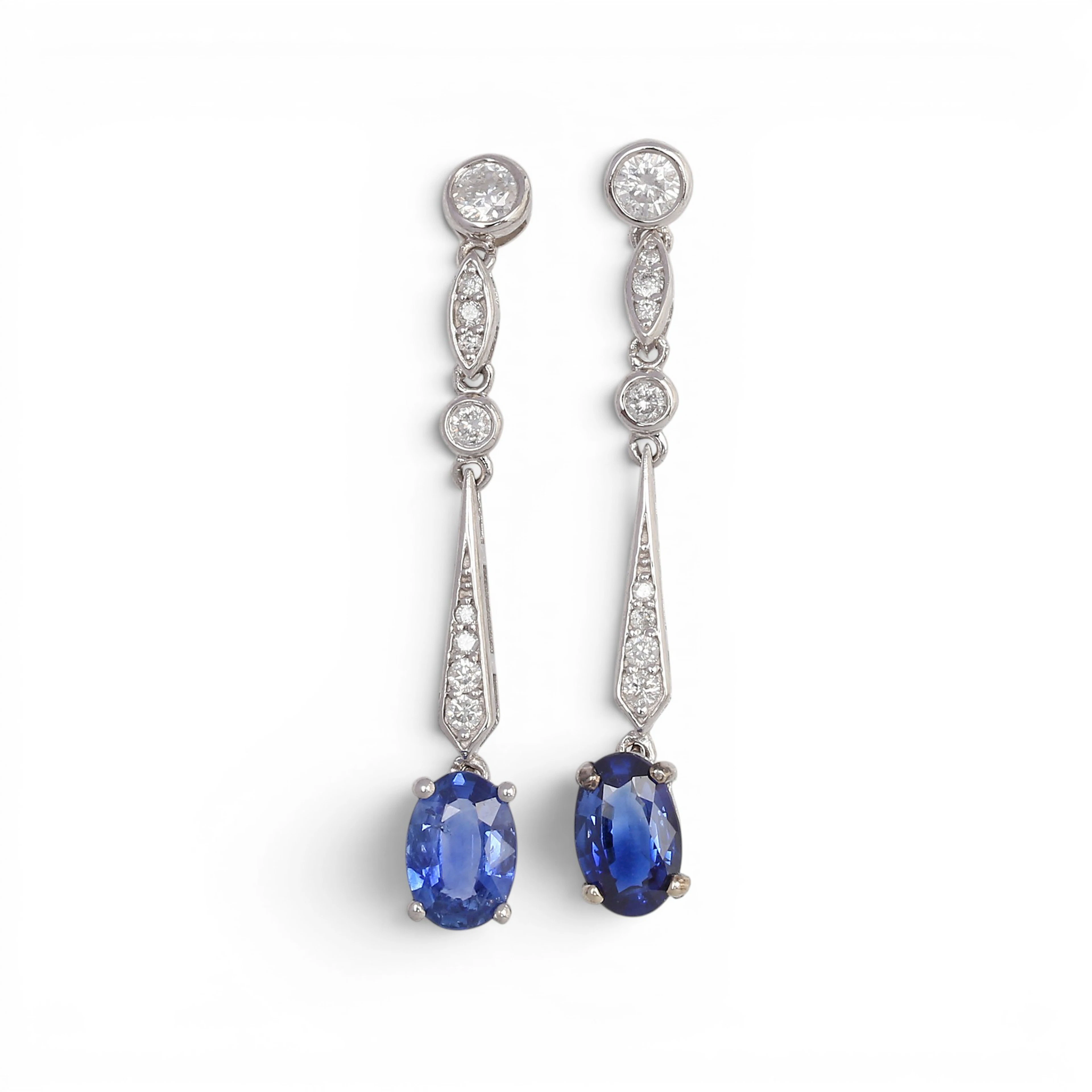 Sapphires and diamonds long earrings.