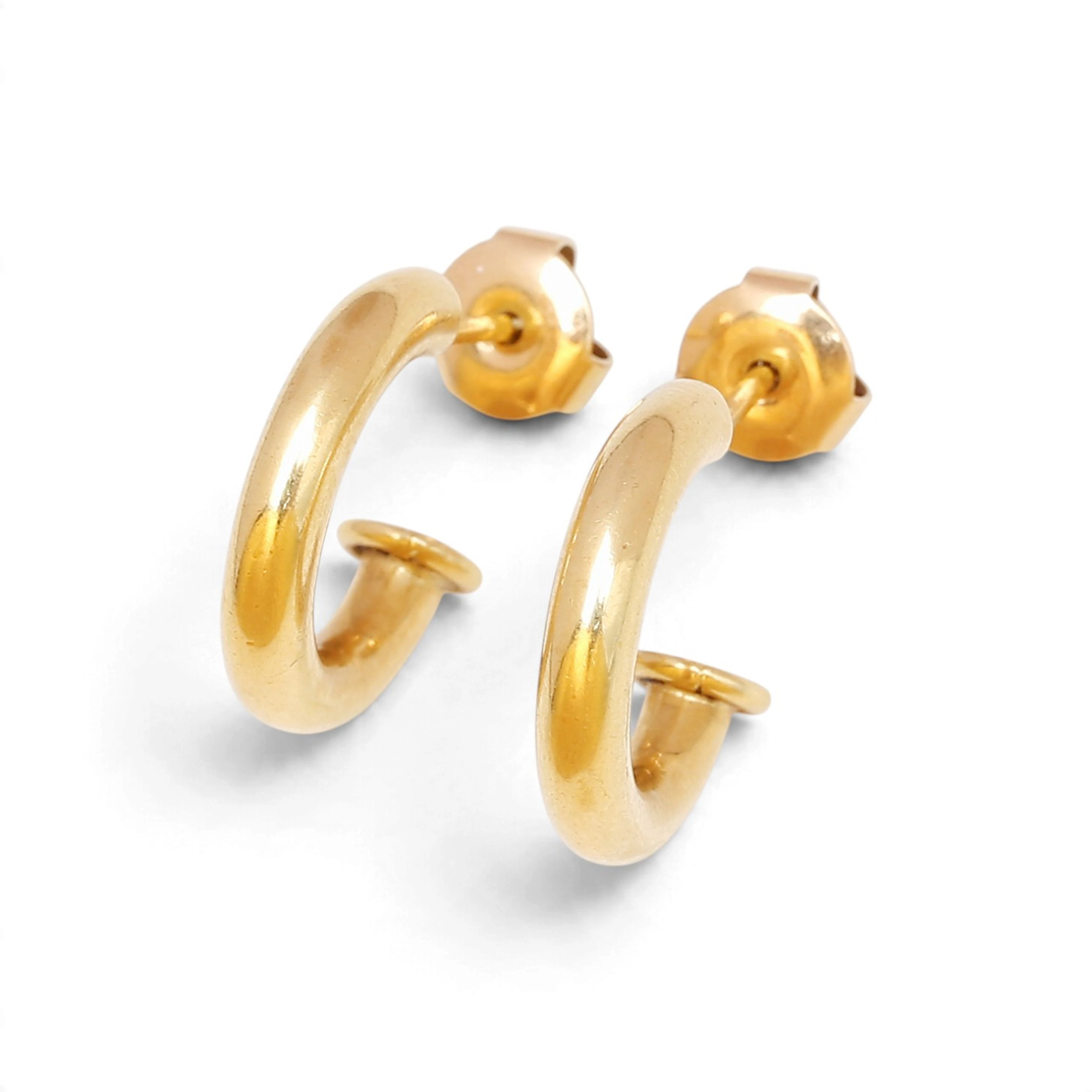 Gold creole earrings.