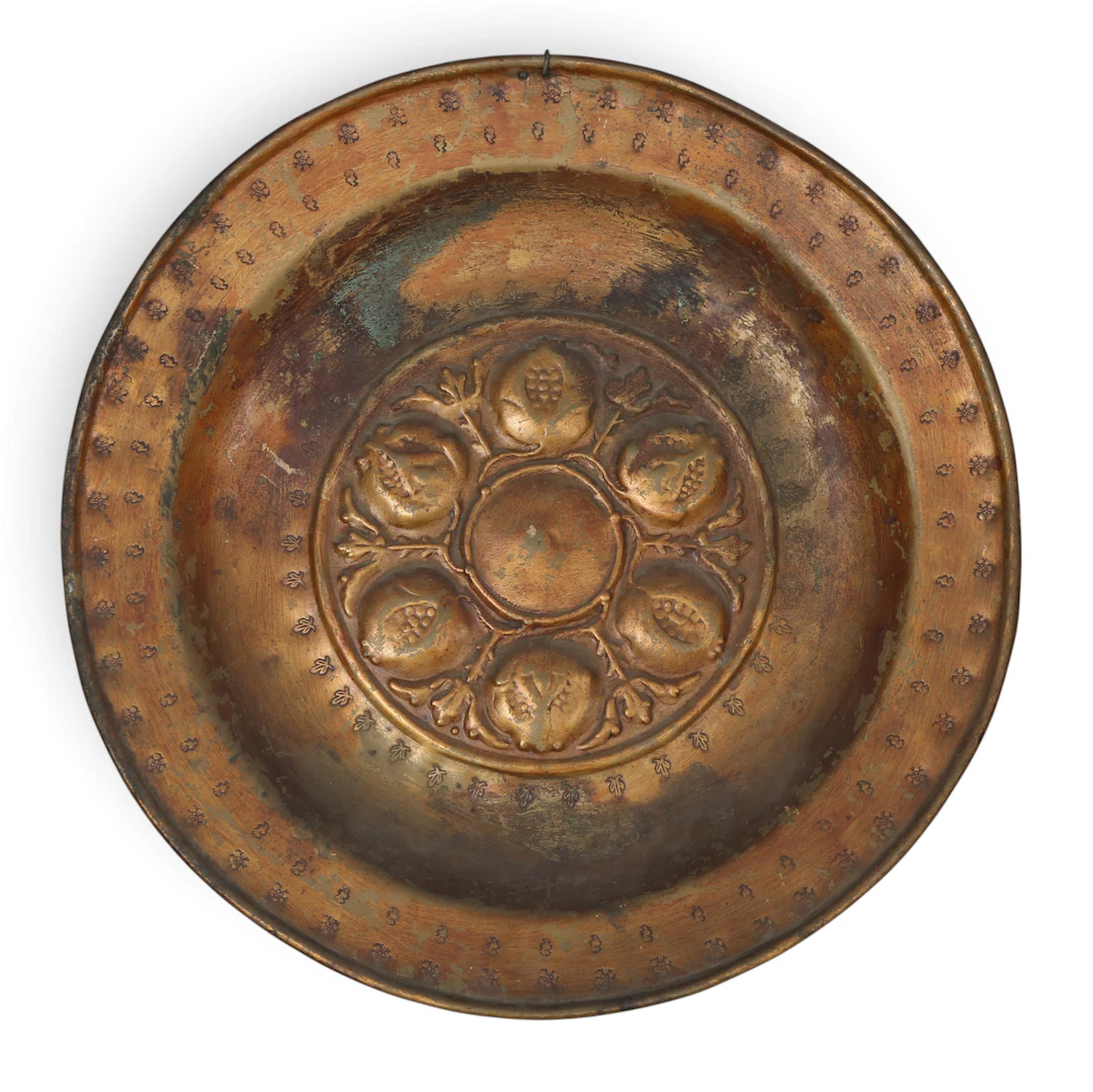 Dinand or Nuremberg alms dish in embossed brass, 16th Century.