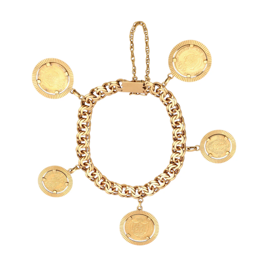 Pulsera en oro con 5 monedas españolas colgantes.