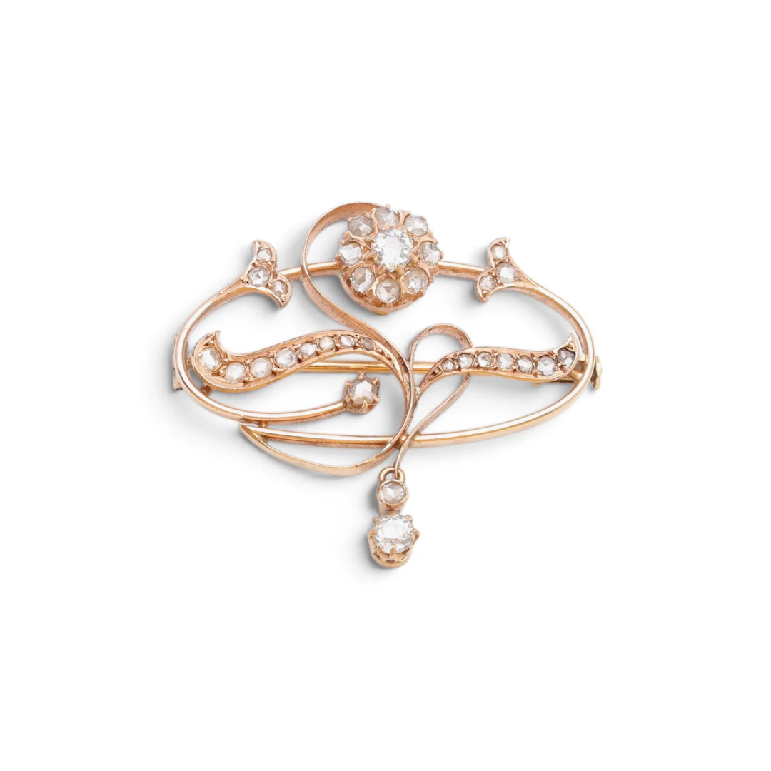 Modernist brooch-pendant in gold and diamonds, early 20th Century.