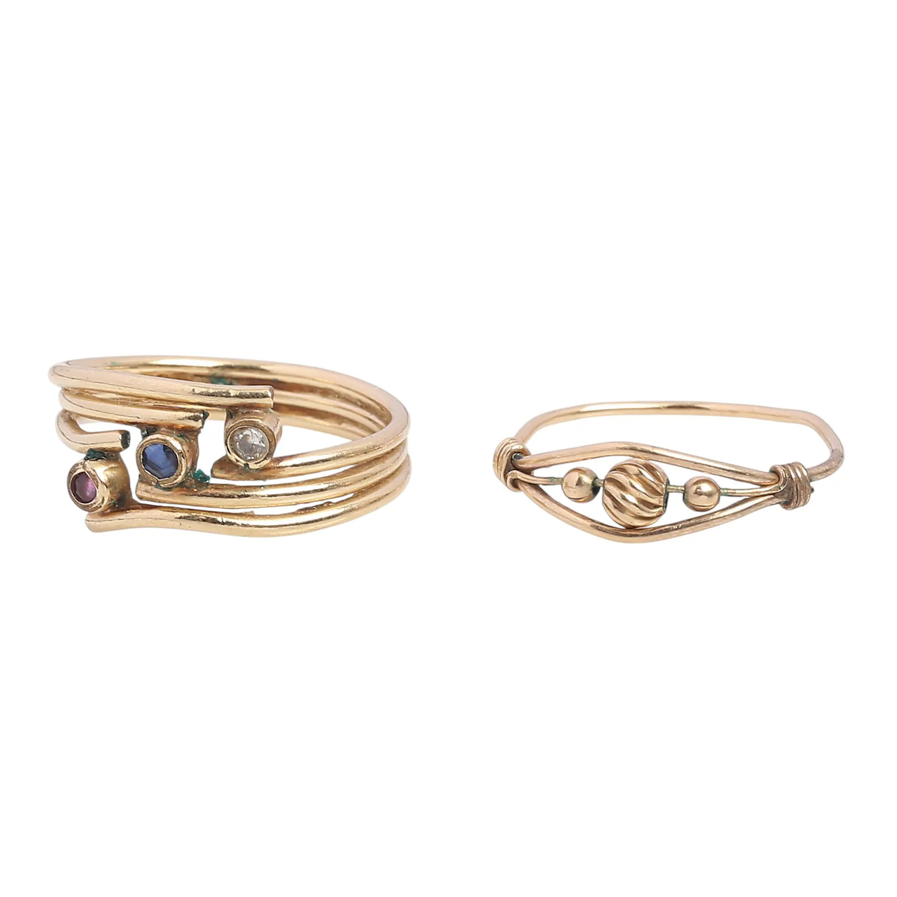 Two over-gilded metal rings.