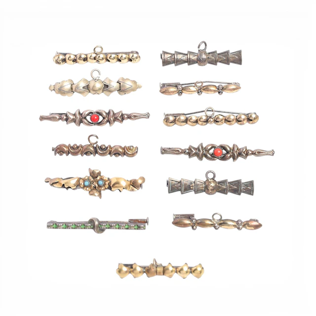 Thirteen silver baptism or communion brooches/pins, first half of