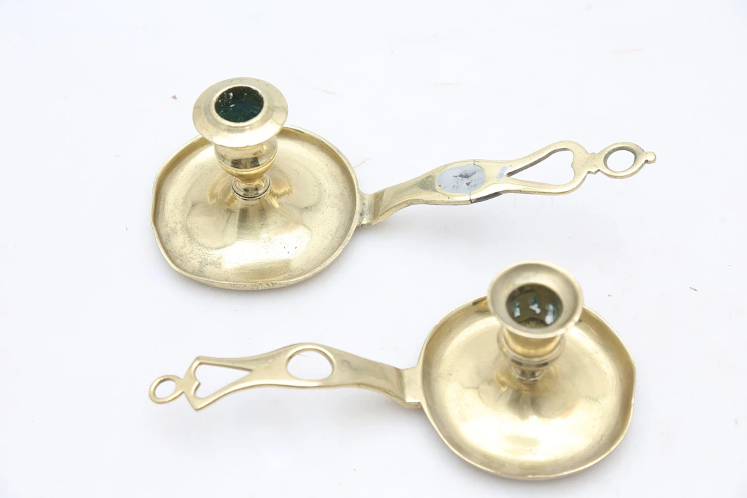 Two brass candle holders, early decades of the 20th Century.