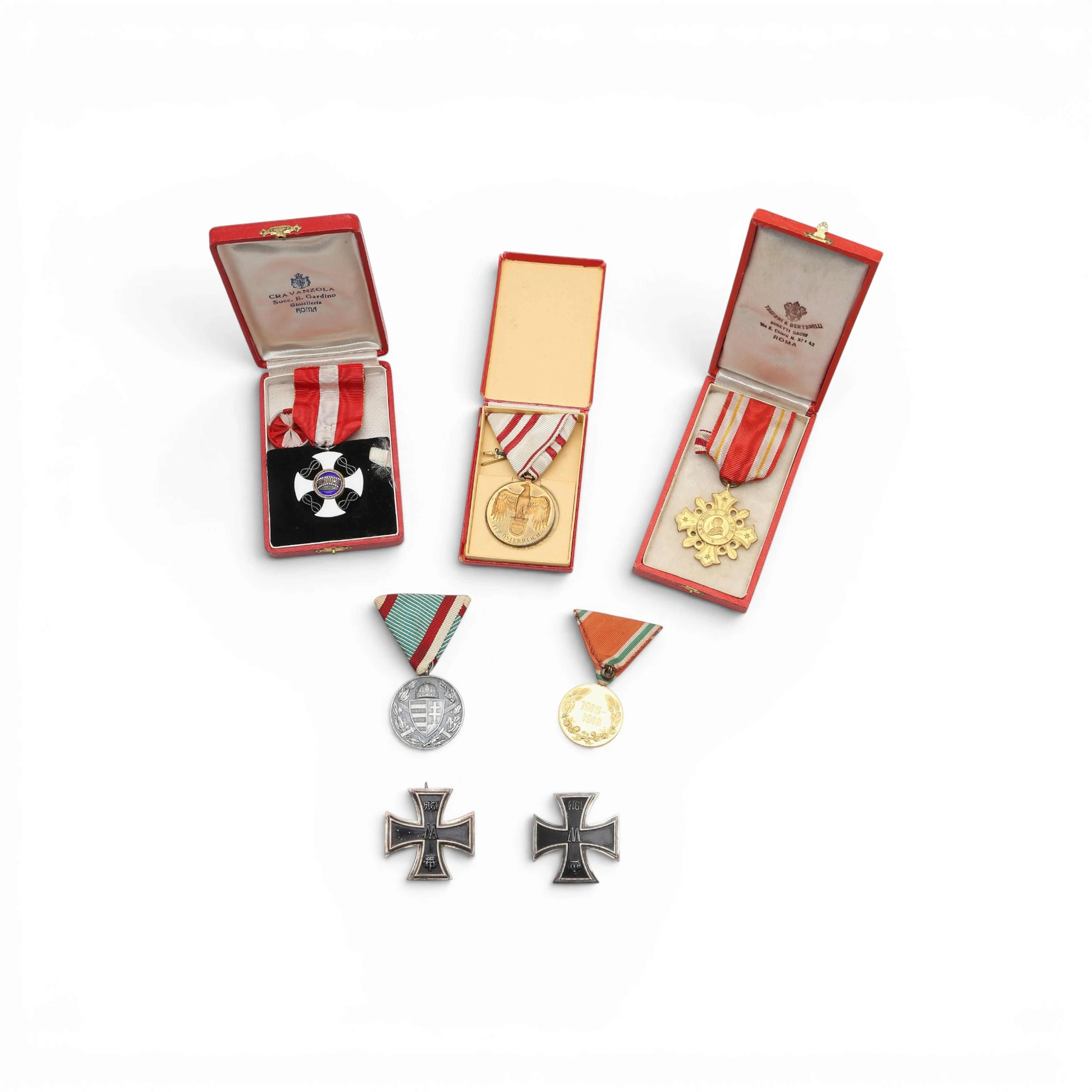 Seven decorations in silver, enamelled silver and gilt metal, from