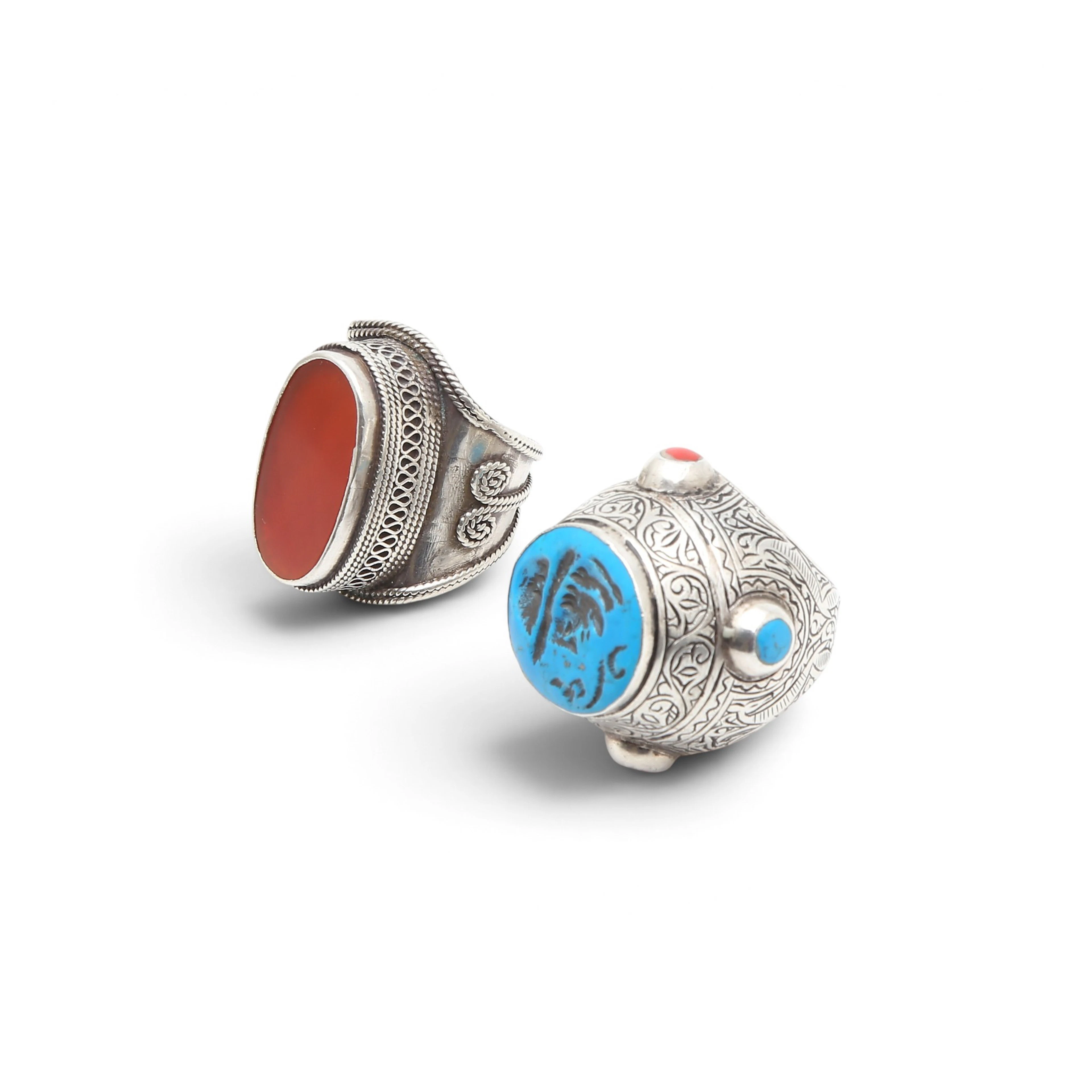Two large Turkish rings in silver, imitation turquoise and carnelian.