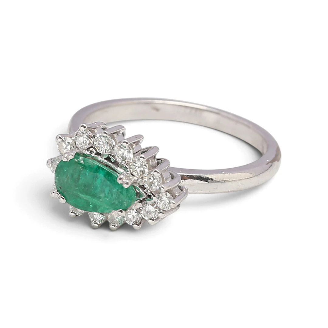 EMERALD and diamond cluster ring.