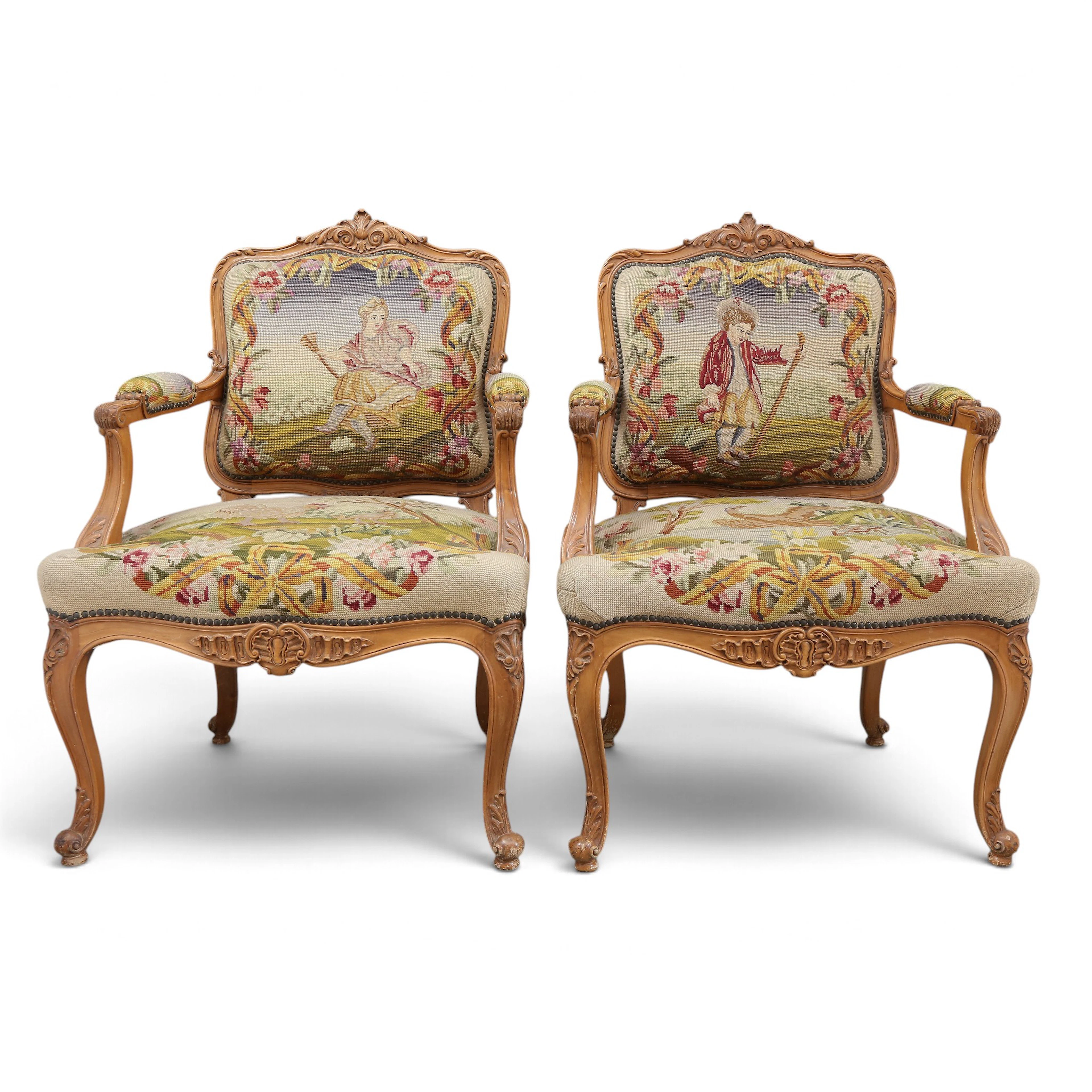 Pair of Louis XV-style “à la reine” armchairs in carved walnut, 20th century.