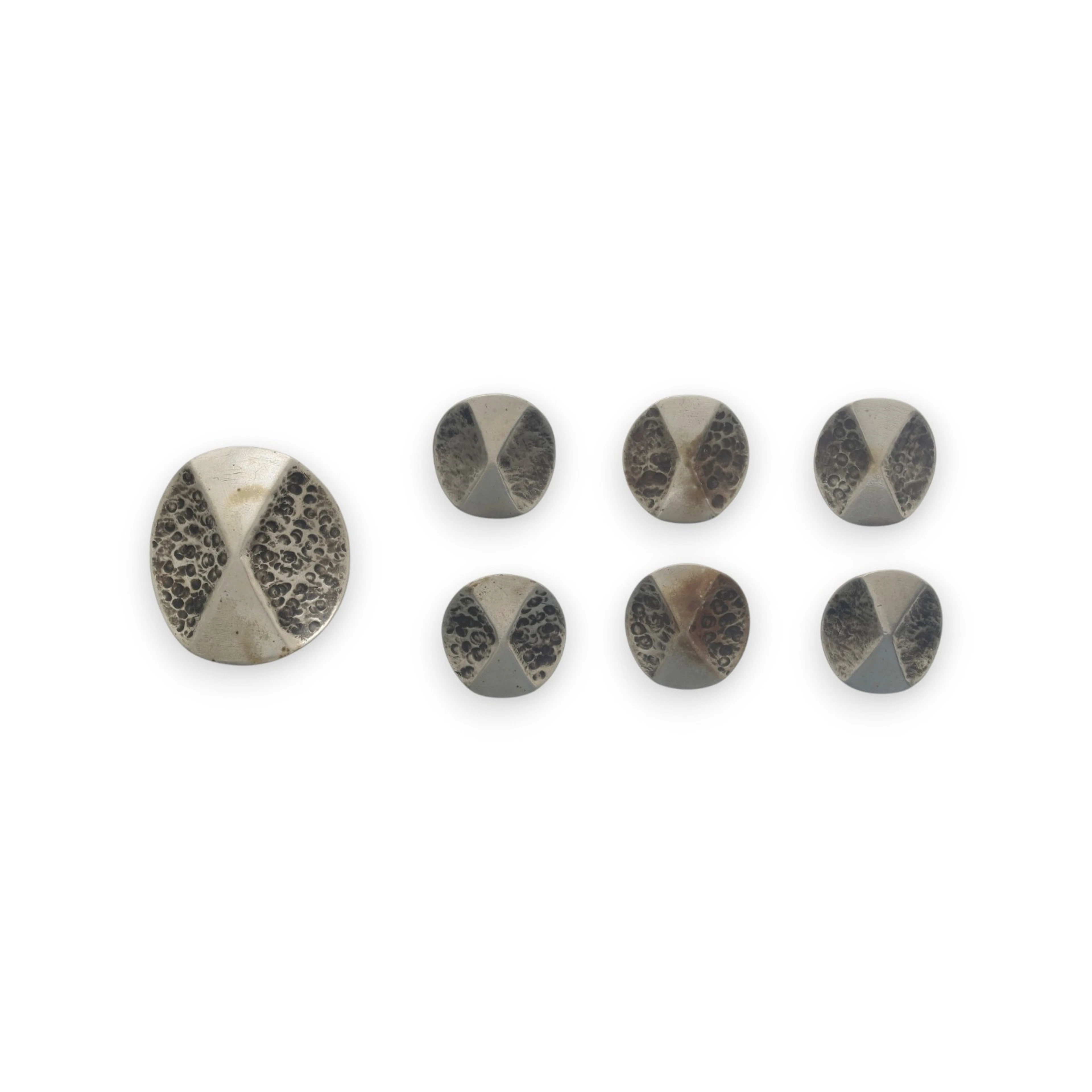 JULIO GONZÁLEZ. Set of seven buttons, circa 1920.