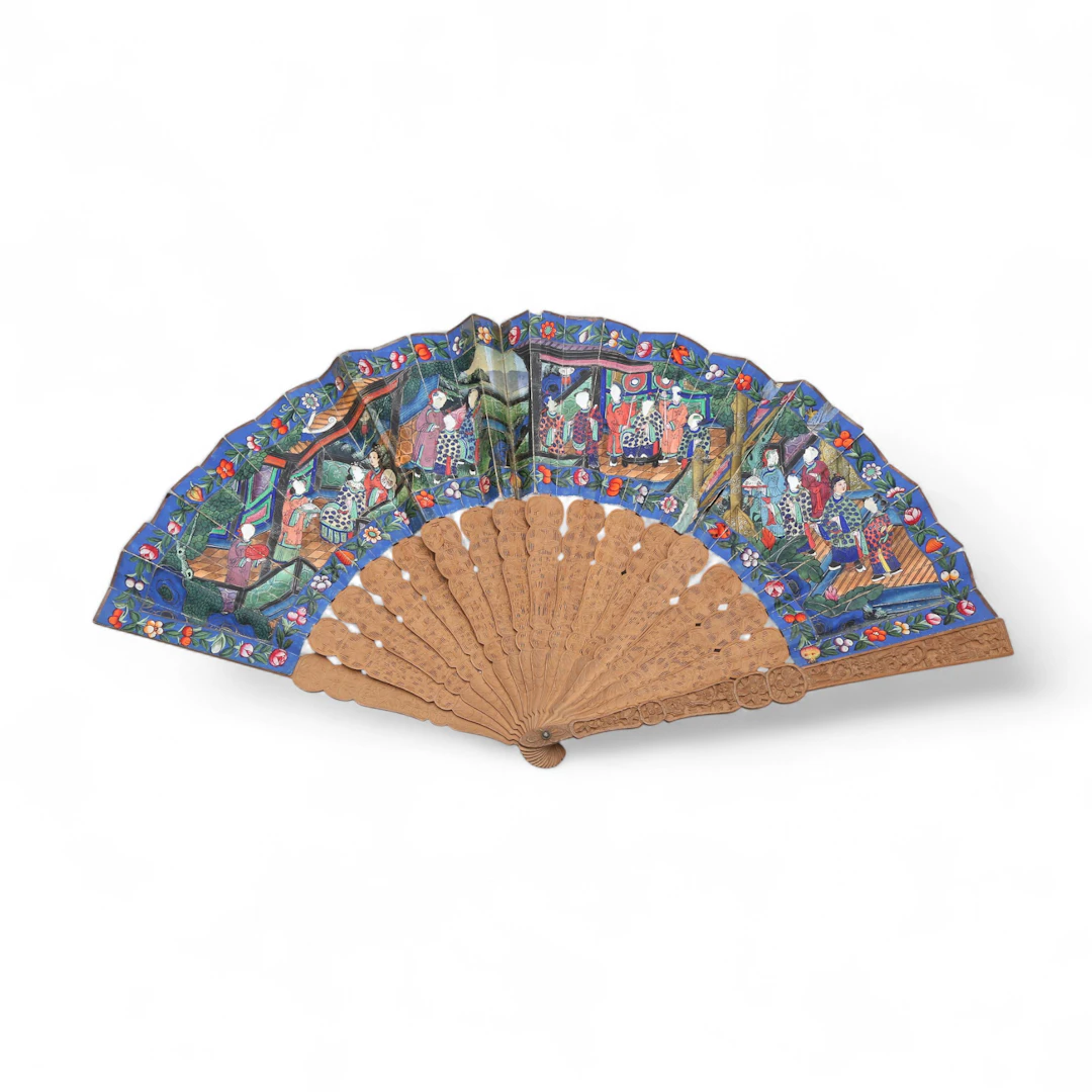 Chinese "thousand faces" fan with painted paper leaf and carved wood