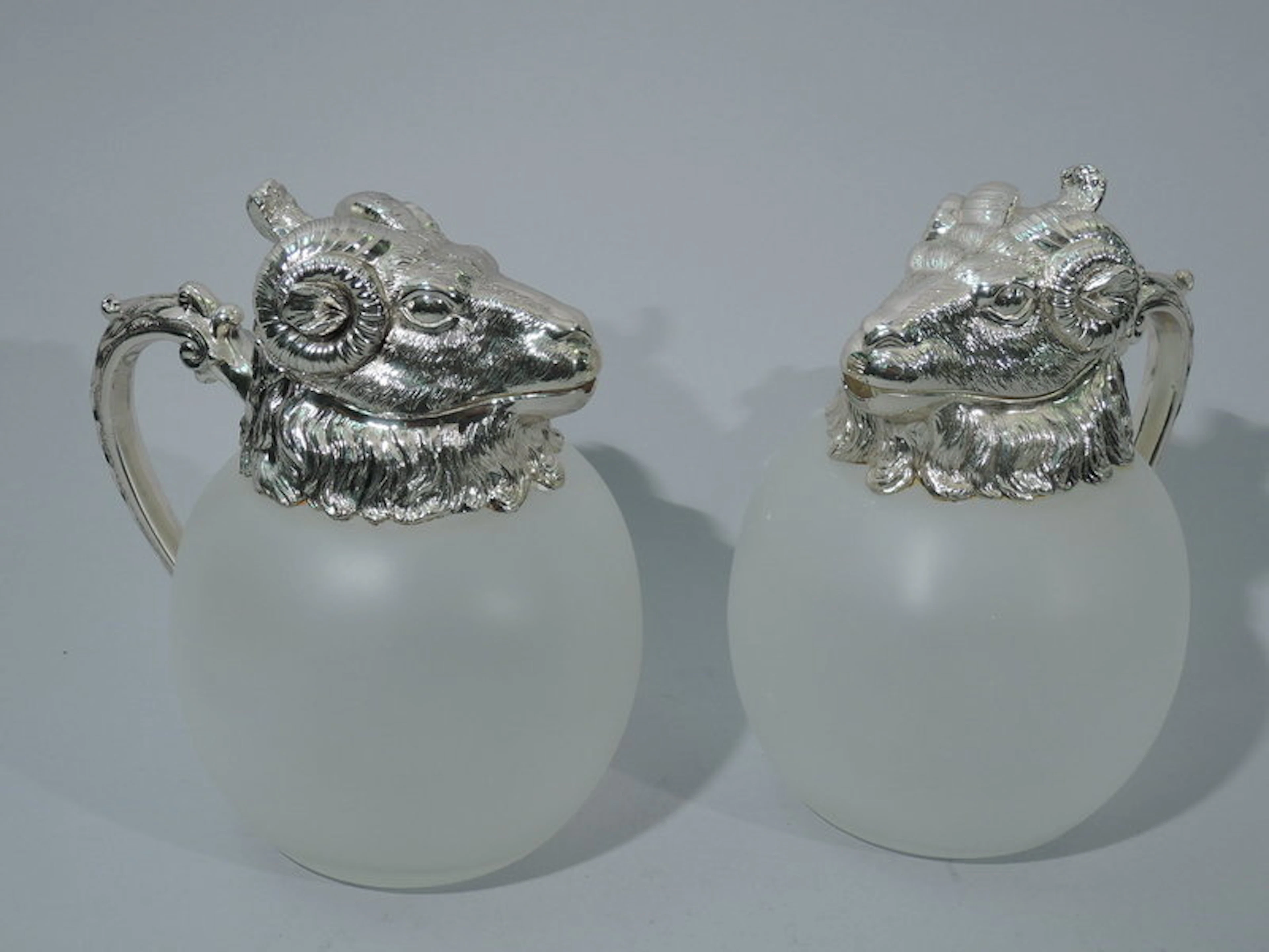 Pair of Neoclassical Camphor Glass Decanters with Rams' Heads